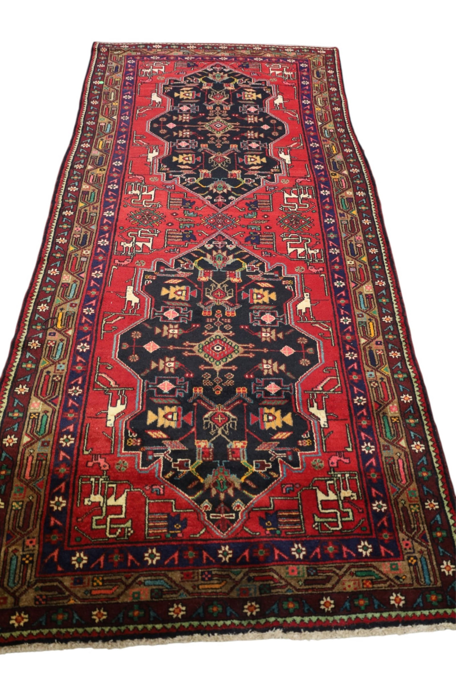 APPROX 9' x 4' HANDMADE WOOL RUG: HANDMADE WOOL RUG.