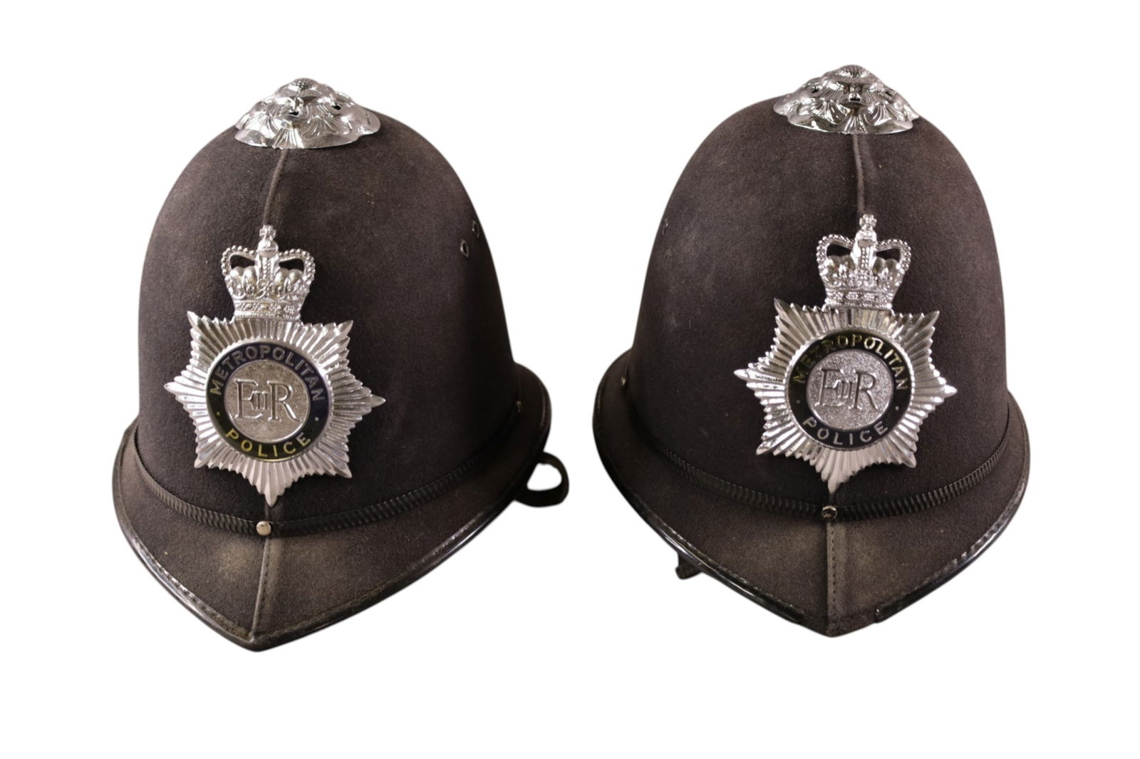 2 BRITISH BOBBY HELMETS: BRITISH POLICE BOBBY HELMETS.