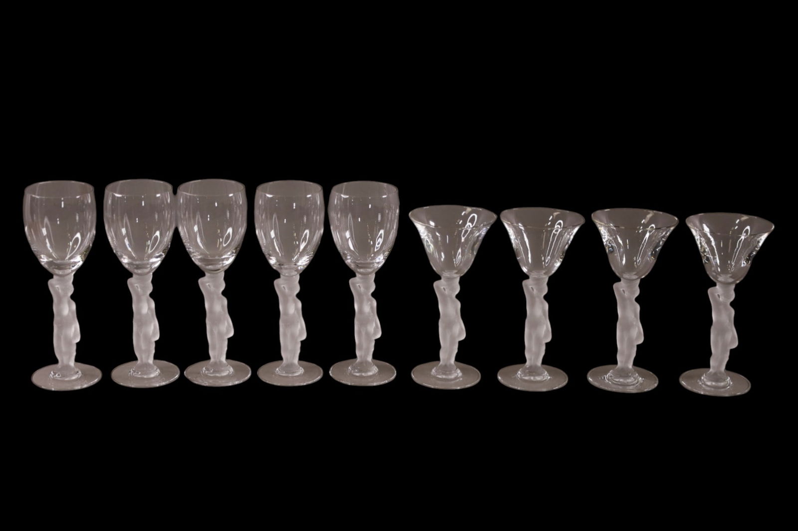 9 CRYSTAL STEMS: FROSTED FIGURAL STEM, CRYSTAL STEMS. VARIOUS SIZES. 6 1/2" - 7" H.