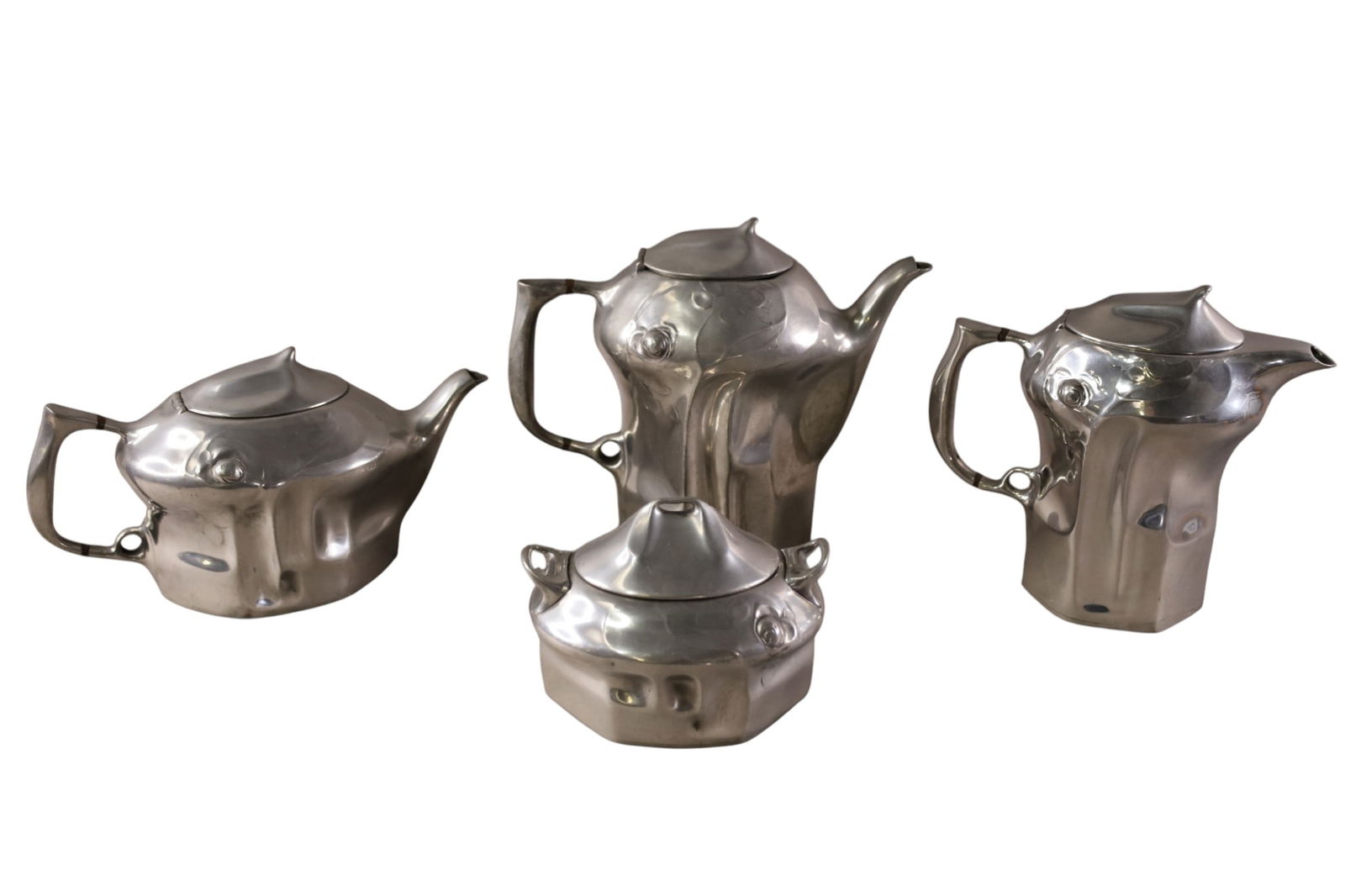 4 PEWTER TEA POTS: ART NOUVEAU PEWTER TEA POTS, FLORAL DECORATED. 4 1/2" - 7 1/2" H.