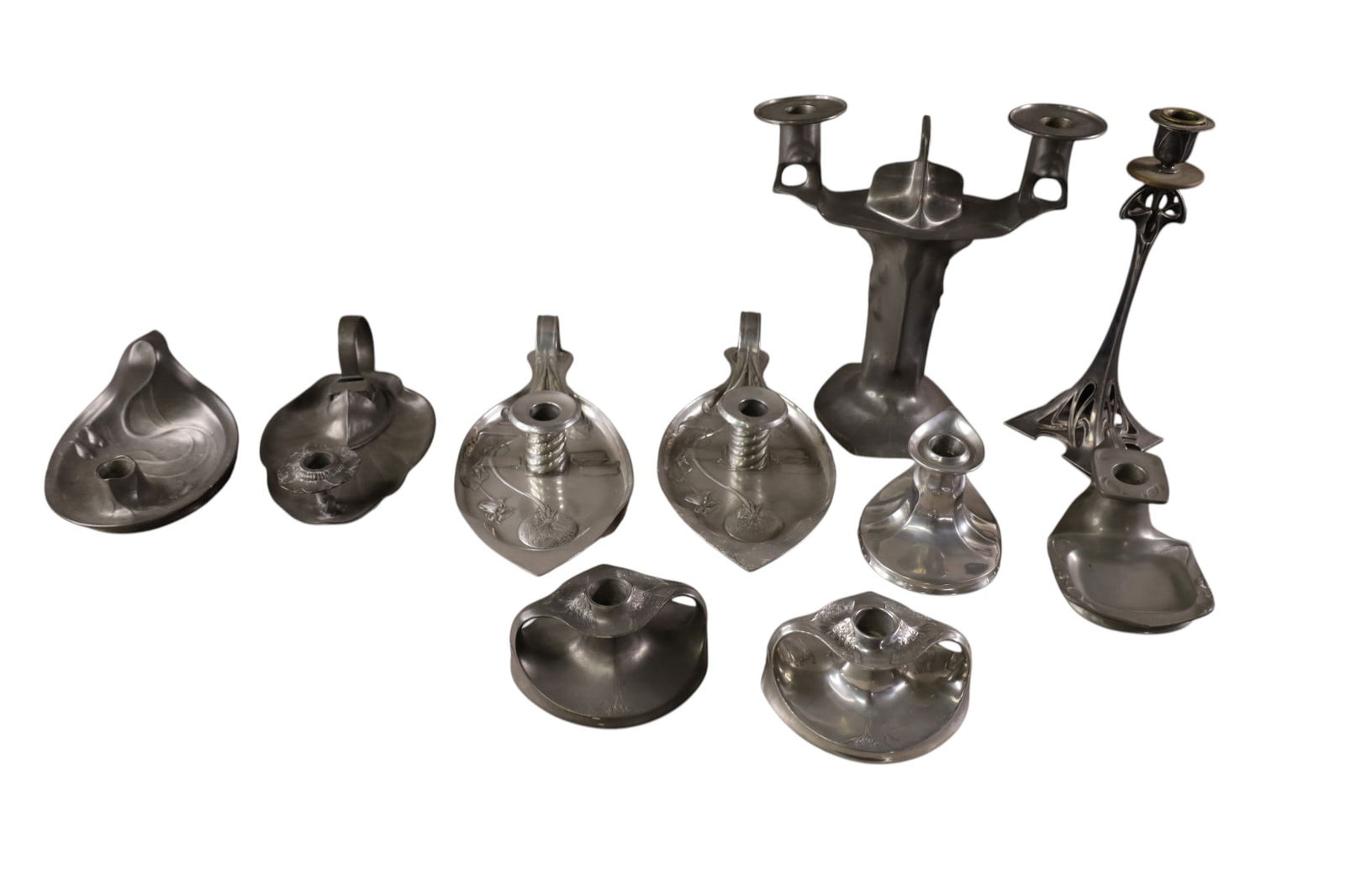 GROUPING OF PEWTER CANDLESTICKS: ART NOUVEAU PEWTER CANDLESTICKS. 10 PCS. 2" - 10 1/2" H.