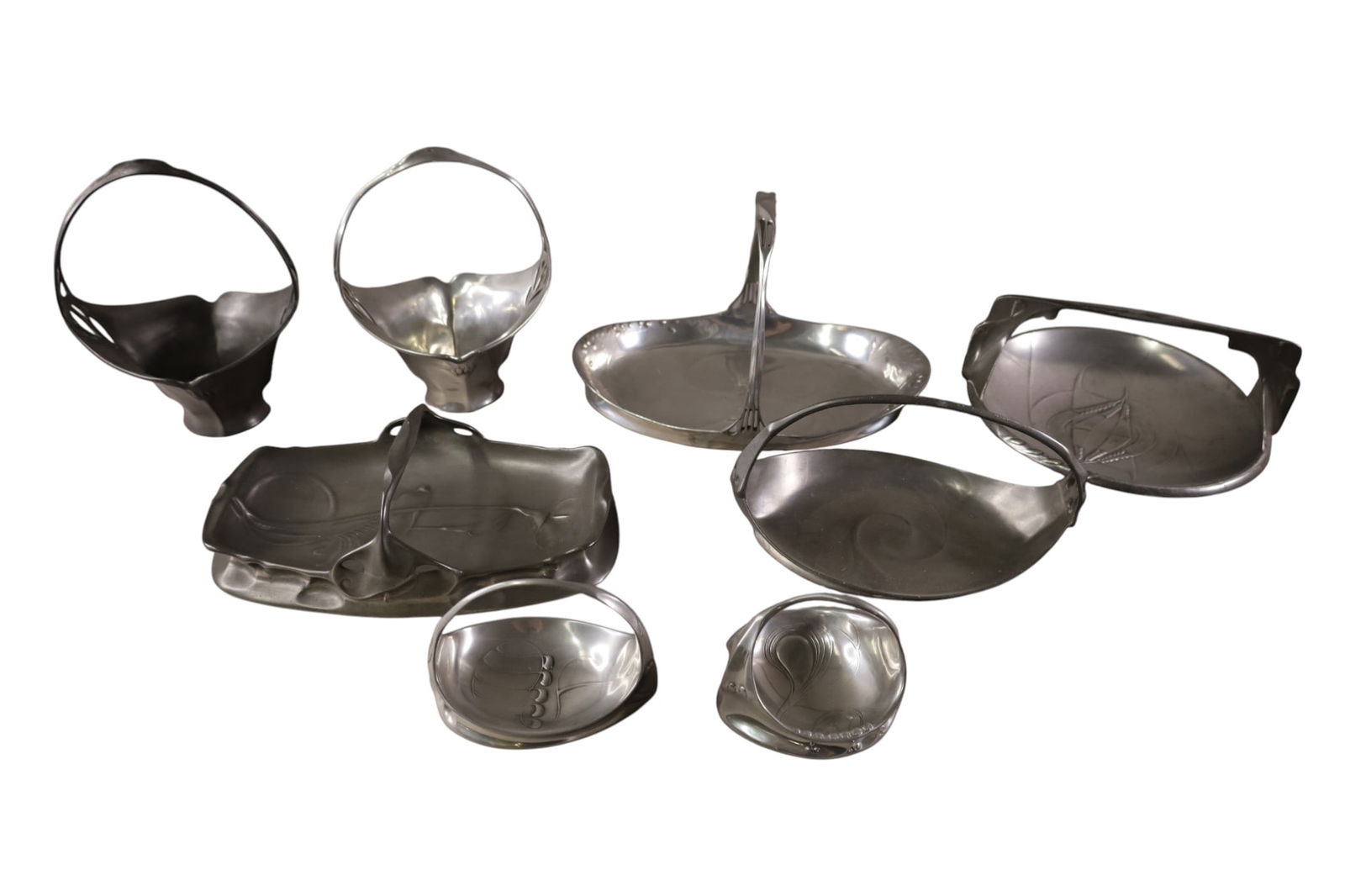 GROUPING OF PEWTER TRAYS & BASKETS: ART NOUVEAU PEWTER TRAYS, HANDLED TRAYS. 4" - 9" H.