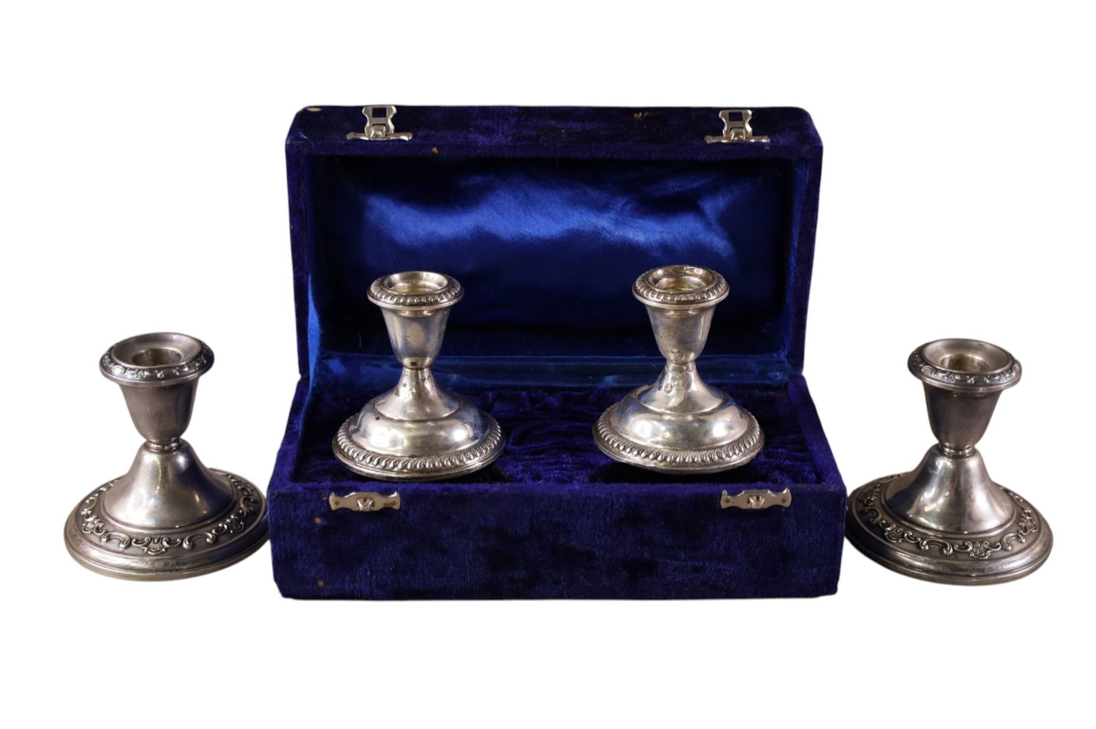 2 PAIRS OF STERLING CANDLESTICKS: 2 PAIRS OF WEIGHTED STERLING CANDELSTICKS, WITH CASE. 3" H.