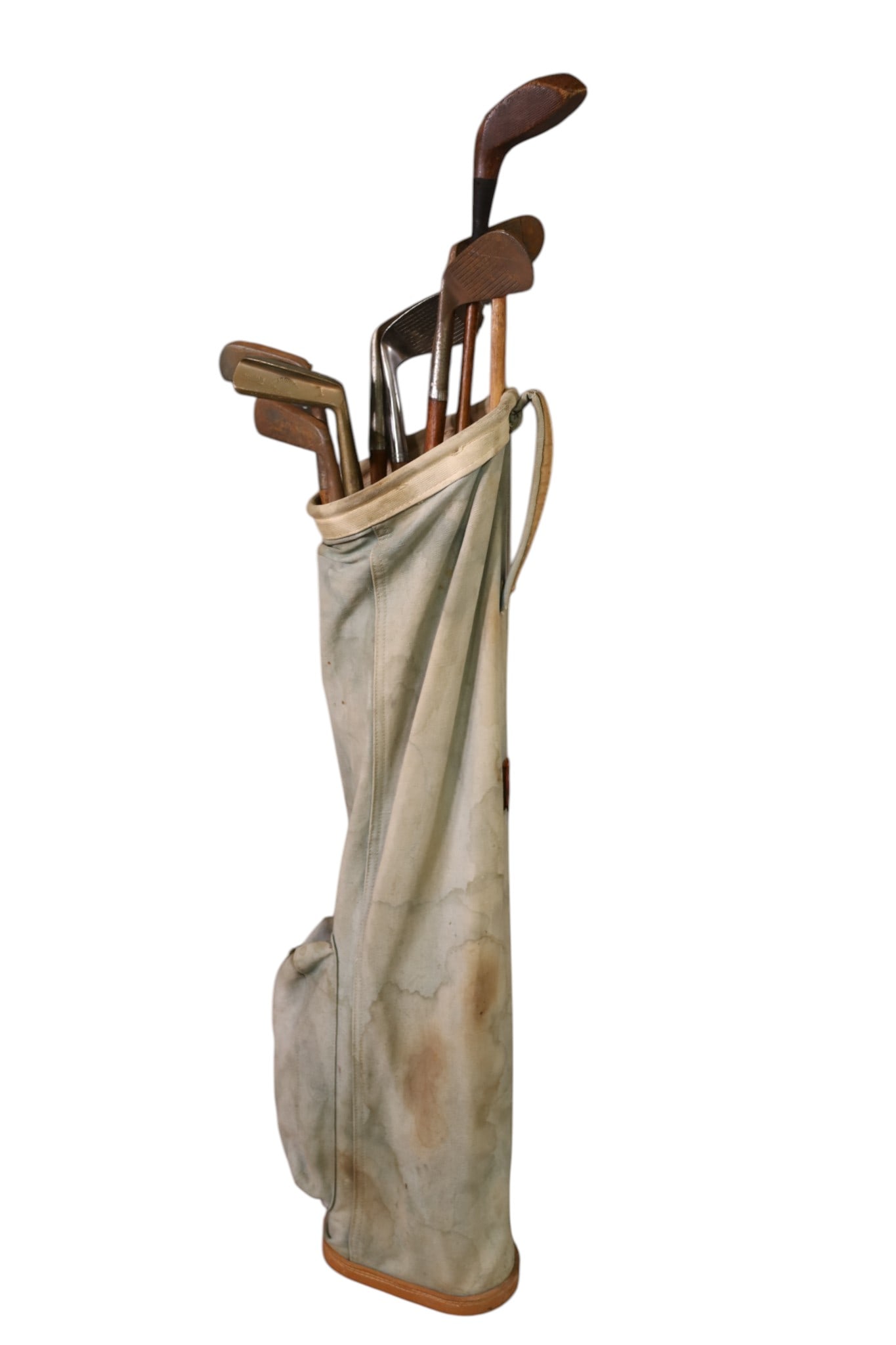 SET OF ANTIQUE GOLF CLUBS: IN CANVAS BAG. WOOD SHAFTS. THIS ITEM EXCEEDS SIZE LIMITATIONS FOR IN HOUSE SHIPPING, MUST BE PICKED UP IN HOUSE OR SHIPPED VIA 3rd PARTY GROUND SHIPPER.