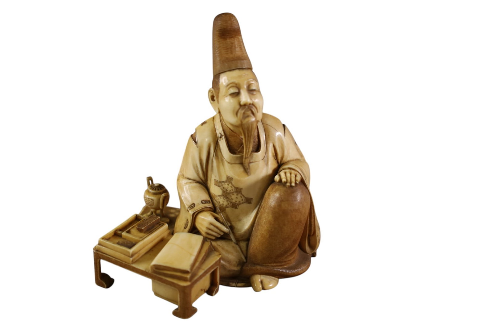 JAPANESE CARVED BONE FIGURE: SEATED OKIMONO CARVED BONE FIGURE, 4" H.