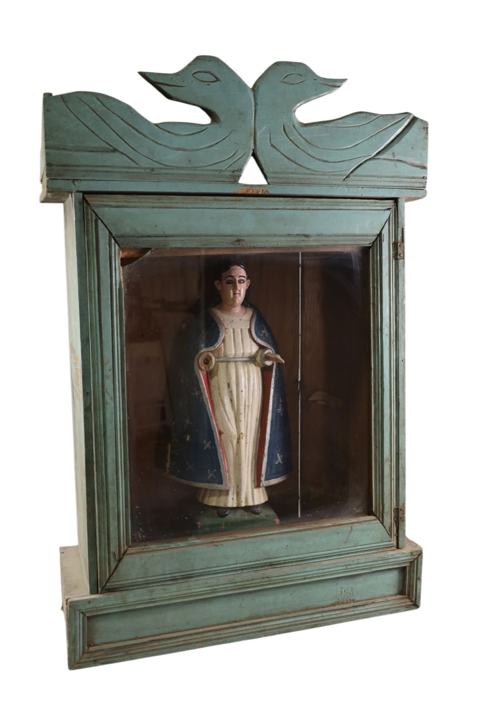 RELIGIOUS SANTO IN SHRINE: POLYCHROME PAINTED RELIGIOUS SANTO IN SHRINE, BREAK TO HAND AND GLASS IN SHRINE. 24" W x 35" H. & 19 1/2" H. FIGURE. THIS ITEM EXCEEDS SIZE LIMITATIONS FOR IN HOUSE SHIPPING, MUST BE PICKED UP IN