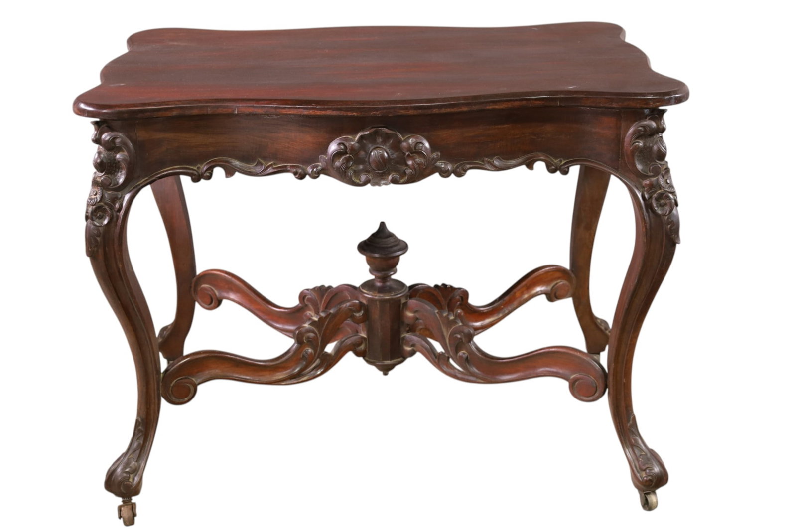 MAHOGANY OCCASIONAL TABLE: CARVED MAHOGANY CENTER TABLE, MINOR WEAR TO FINISH. HIGHLY CARVED BASE. 38" L x 25" W x 30" H. THIS ITEM EXCEEDS SIZE LIMITATIONS FOR IN HOUSE SHIPPING, MUST BE PICKED UP IN HOUSE OR SHIPPED VIA