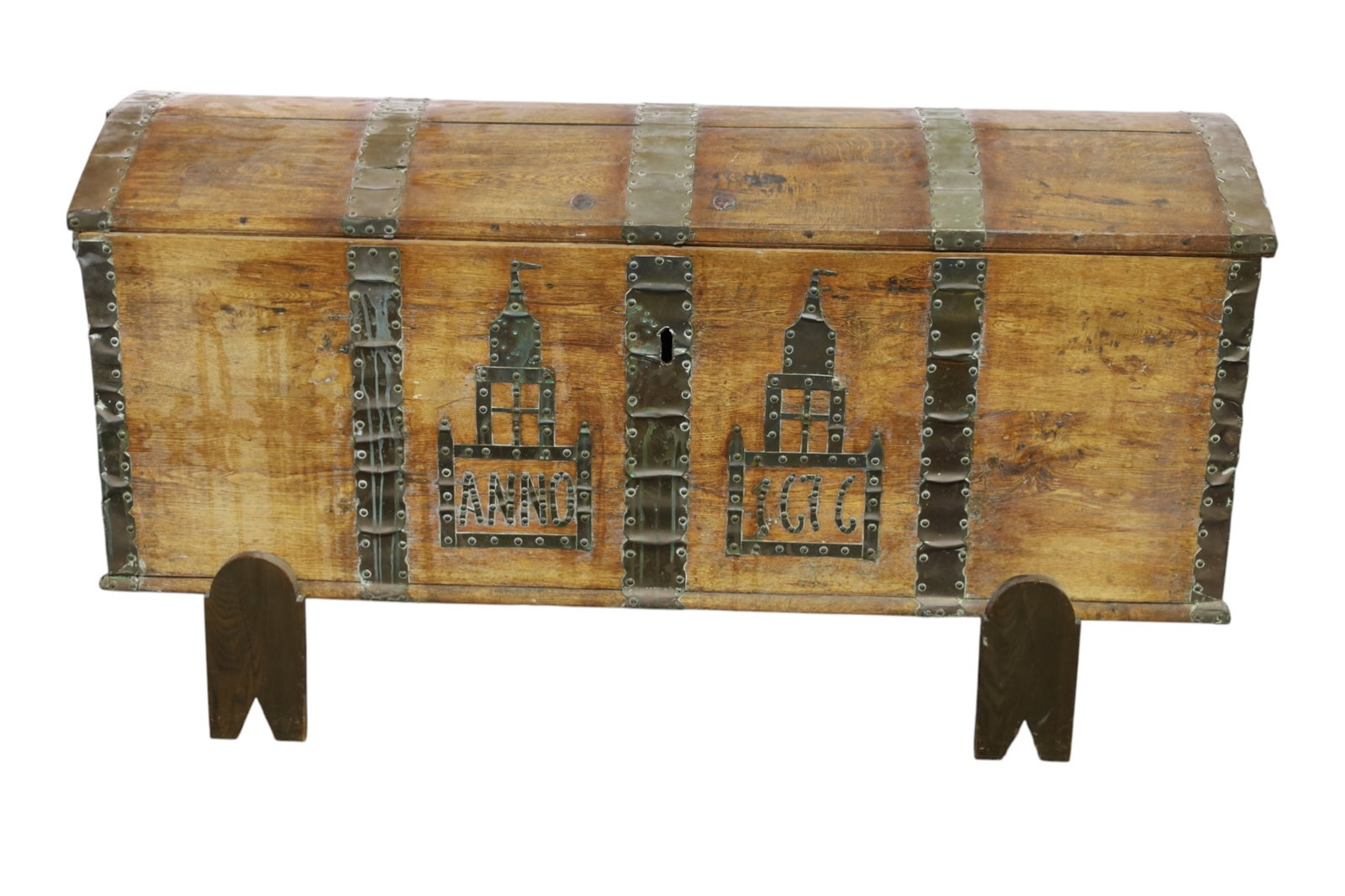 LARGE TRUNK: BRASS DECORATED TRUNK, IRON STRAPPED. ON STAND. 62" W x 26" D x 26" H. THIS ITEM EXCEEDS SIZE LIMITATIONS FOR IN HOUSE SHIPPING, MUST BE PICKED UP IN HOUSE OR SHIPPED VIA 3rd PARTY GROUND SHIPPER.