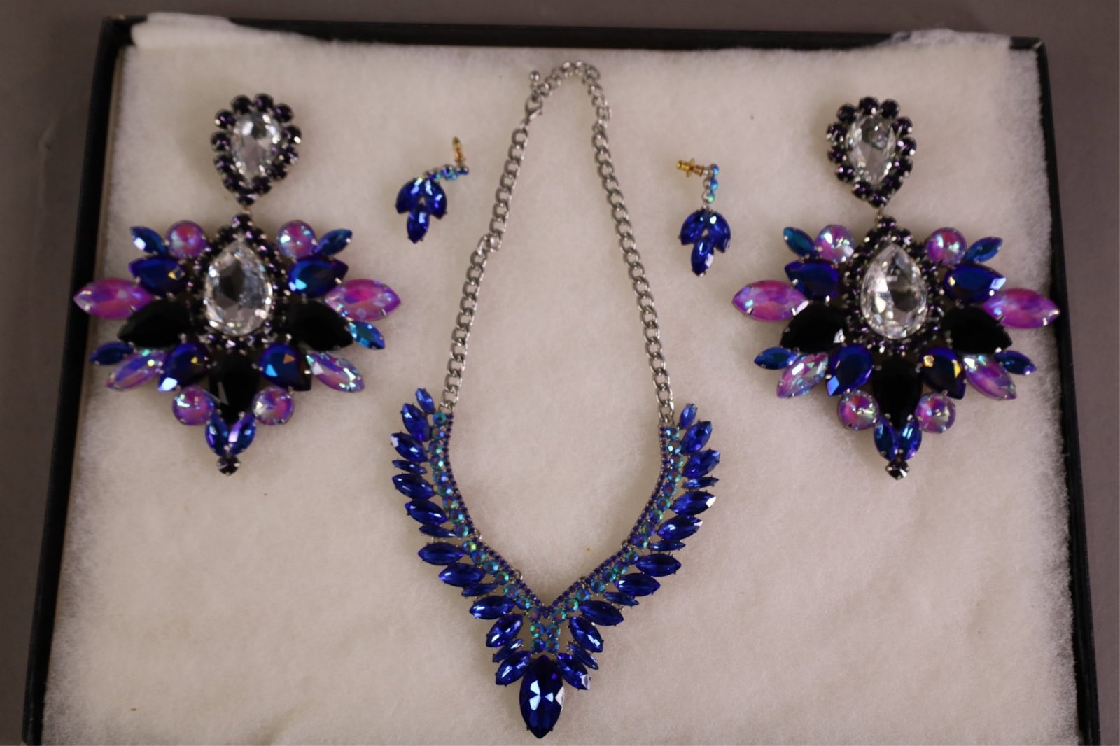 GROUPING OF COSTUME JEWELRY: LARGE RHINESTONE EARRINGS, & 3 PIECE JEWELRY SET. 6" H. EARRINGS.