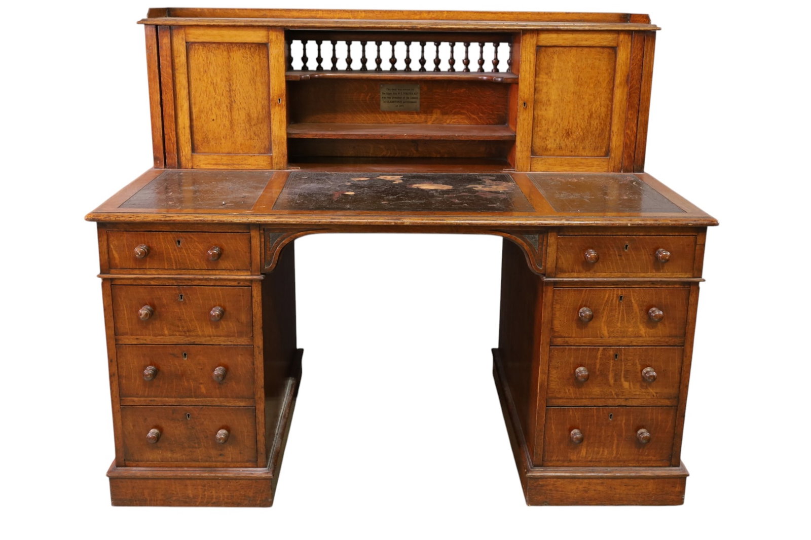 UNUSUAL 1800'S LEATHER TOP DESK: OAK, LEATHER TOP DESK, UPPER DOORS AND OPEN SHELVING. MINOR WEAR TO FINISH. DAMAGE TO LEATHER. 56" W x 33" D x 48" H. THIS ITEM EXCEEDS SIZE LIMITATIONS FOR IN HOUSE SHIPPING, MUST BE PICKED UP IN
