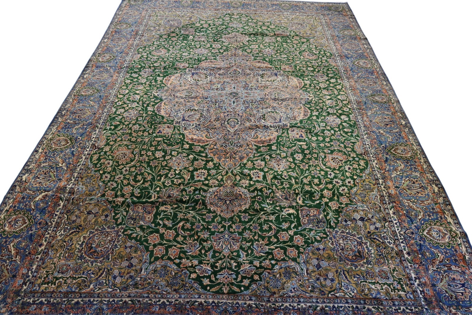 APPROX 12' x 19' 7" HANDMADE WOOL RUG: ROOMSIZE HANDMADE QUM WOOL RUG, AREAS OF LOW PILE. THIS ITEM EXCEEDS SIZE LIMITATIONS FOR IN HOUSE SHIPPING, MUST BE PICKED UP IN HOUSE OR SHIPPED VIA 3rd PARTY GROUND SHIPPER.