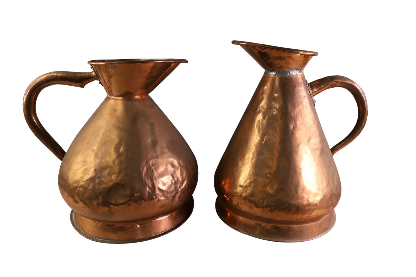 2 LARGE COPPER JUGS: 2 LARGE COPPER, HAYSTACK SHAPED JUGS, MEASURING JUGS. ONE MARKED GR14. 17" H. THIS ITEM EXCEEDS SIZE LIMITATIONS FOR IN HOUSE SHIPPING, MUST BE PICKED UP IN HOUSE OR SHIPPED VIA 3rd PARTY GROUND