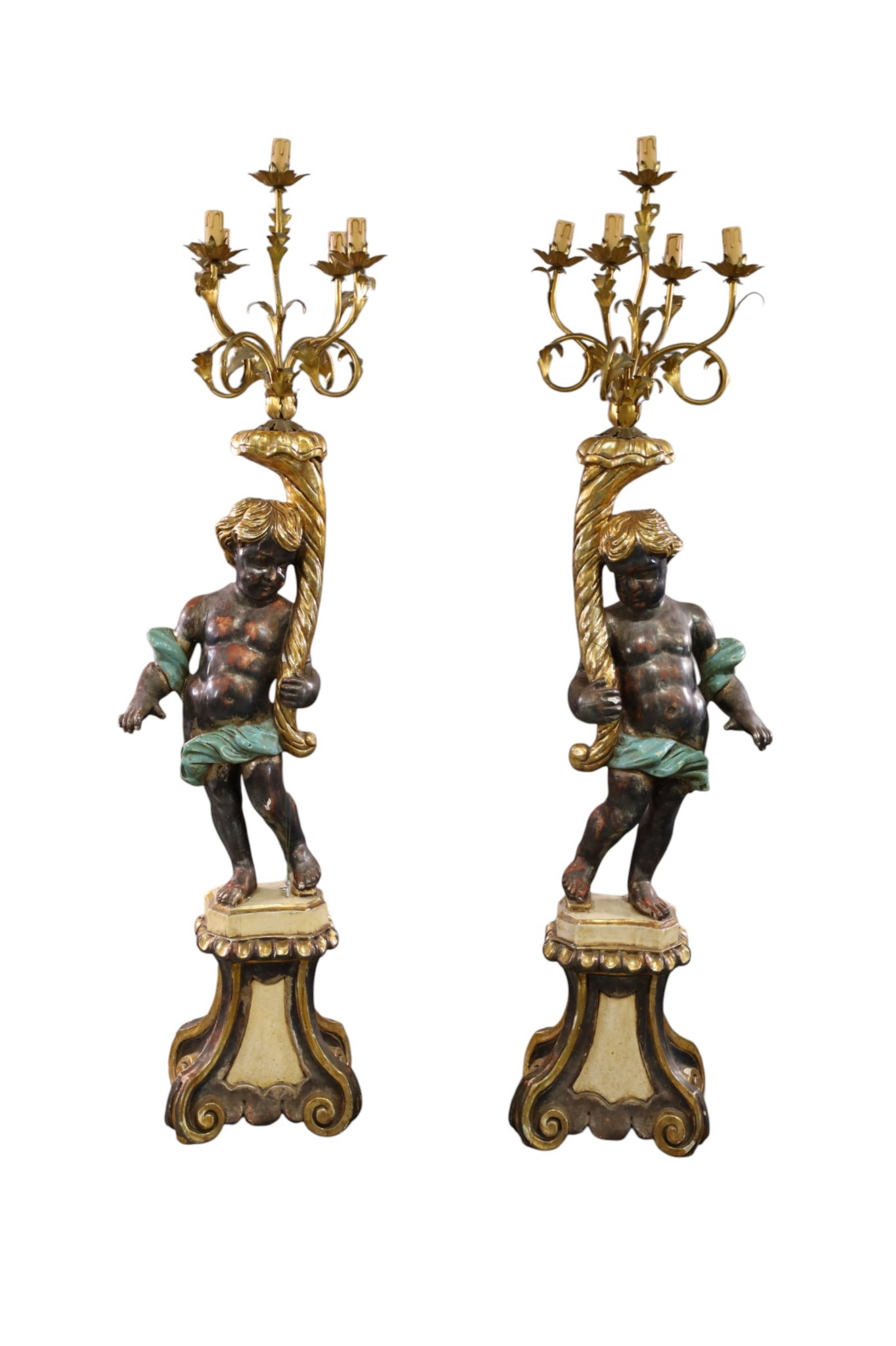 PAIR OF LARGE PUTTI FLOOR CANDELABRA LAMPS: PAIR OF LARGE PUTTI FORM CANDELABRAS, WOOD AND GESSO PUTTI FIGURES, 5 LIGHT UPPER. CHIPS AND MINOR LOSS TO FINISH. 65" H. THIS ITEM EXCEEDS SIZE LIMITATIONS FOR IN HOUSE SHIPPING, MUST BE PICKED UP