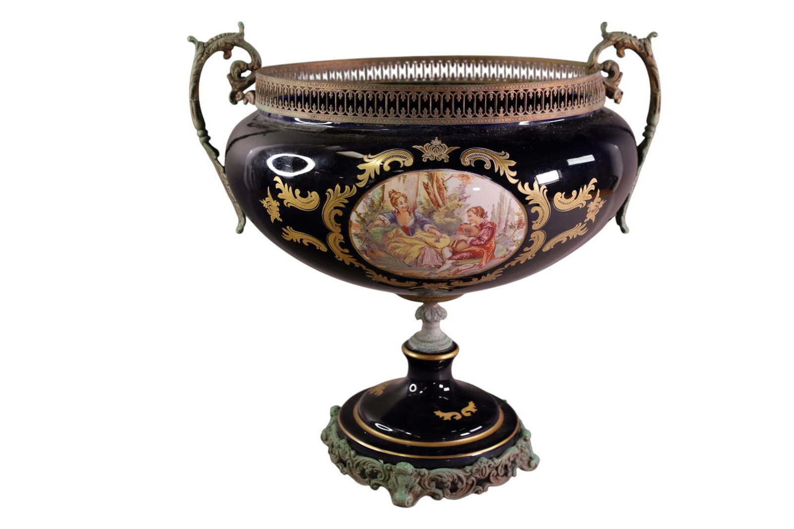 SEVRES STYLE CENTER BOWL: LARGE SEVRES STYLE CENTER BOWL, FOOTED AND HANDLED CENTER BOWL. DISCOLORATION TO BRASS. CHIPS ALONG INTERIOR. 16" DIAM x 16" H. THIS ITEM EXCEEDS SIZE LIMITATIONS FOR IN HOUSE SHIPPING, MUST BE
