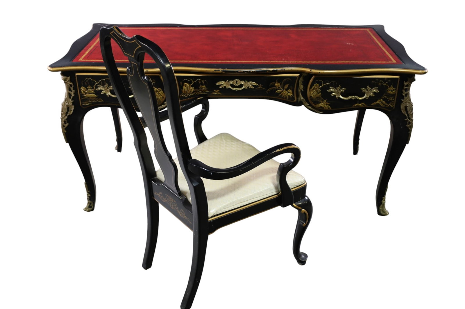 LARGE CHINOISERIE STYLE BUREAUPLAT DESK: BLACK LACQUER AND GILT, WITH CHINESE INSPIRED CHINOISERE DECORATION, WITH CHAIR, PAINT LOSS TO FINISH. SCUFF TO LEATHER, 60" W X 28" D x 29" H. THIS ITEM EXCEEDS SIZE LIMITATIONS FOR IN HOUSE