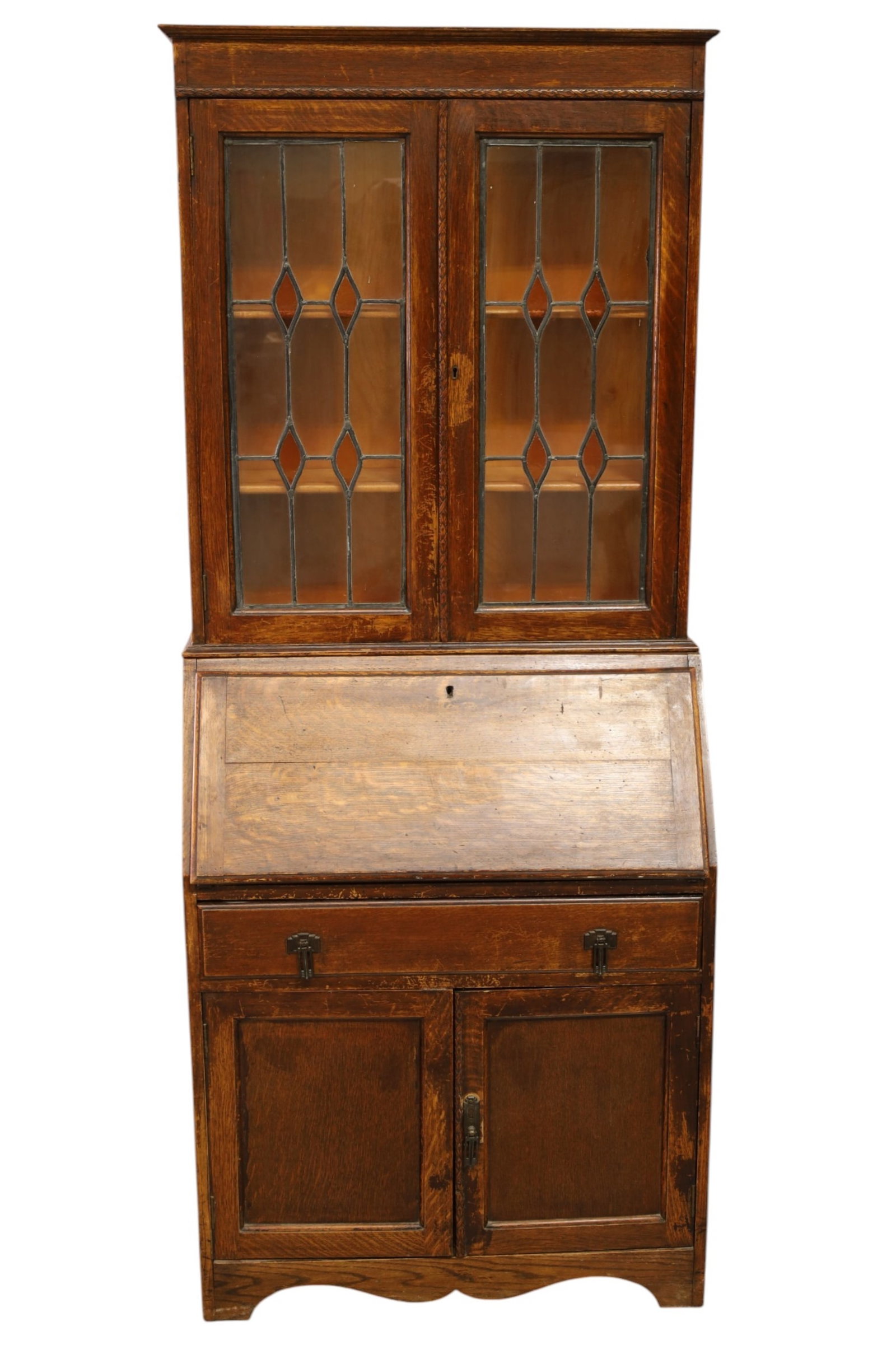 OAK SECRETARY: ENGLISH OAK SECRETARY, BOOKCASE TOP, LEADED GLASS TOP. MINOR WEAR TO FININSH. 30" W x 14" D x 73" H. THIS ITEM EXCEEDS SIZE LIMITATIONS FOR IN HOUSE SHIPPING, MUST BE PICKED UP IN HOUSE OR SHIPPED