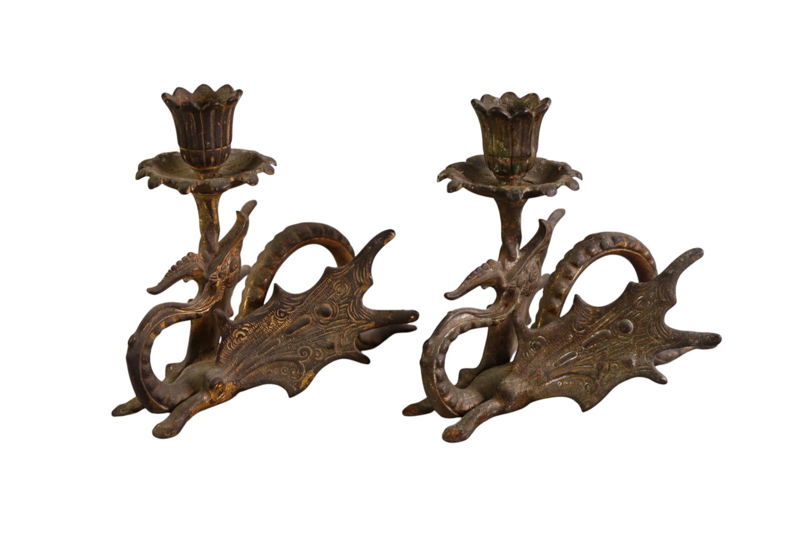 PAIR OF CAST METAL DRAGON FORM CANDLESTICKS: PAIR OF DRAGON FORM TABLE TOP CANDELSTICKS. 6 1/2" H