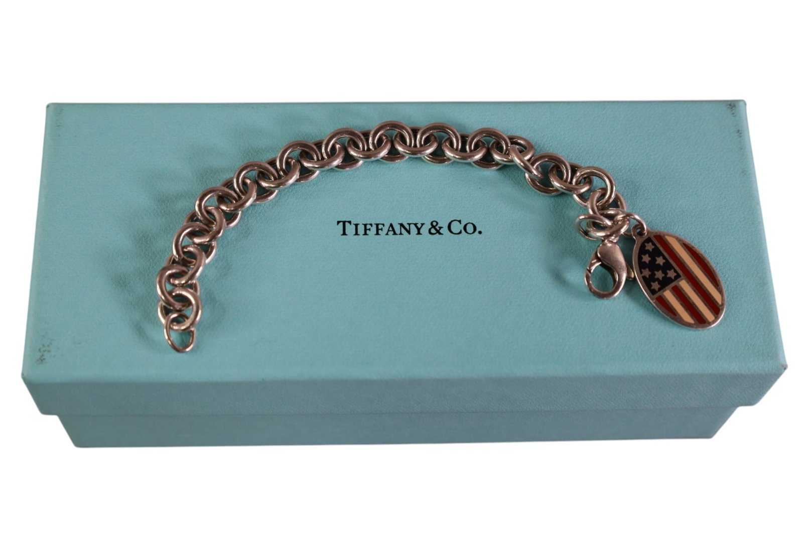 TIFFANY & CO BRACELET: TIFFANY & CO STERLING BRACELET WITH AMERICAN FLAG. 7"