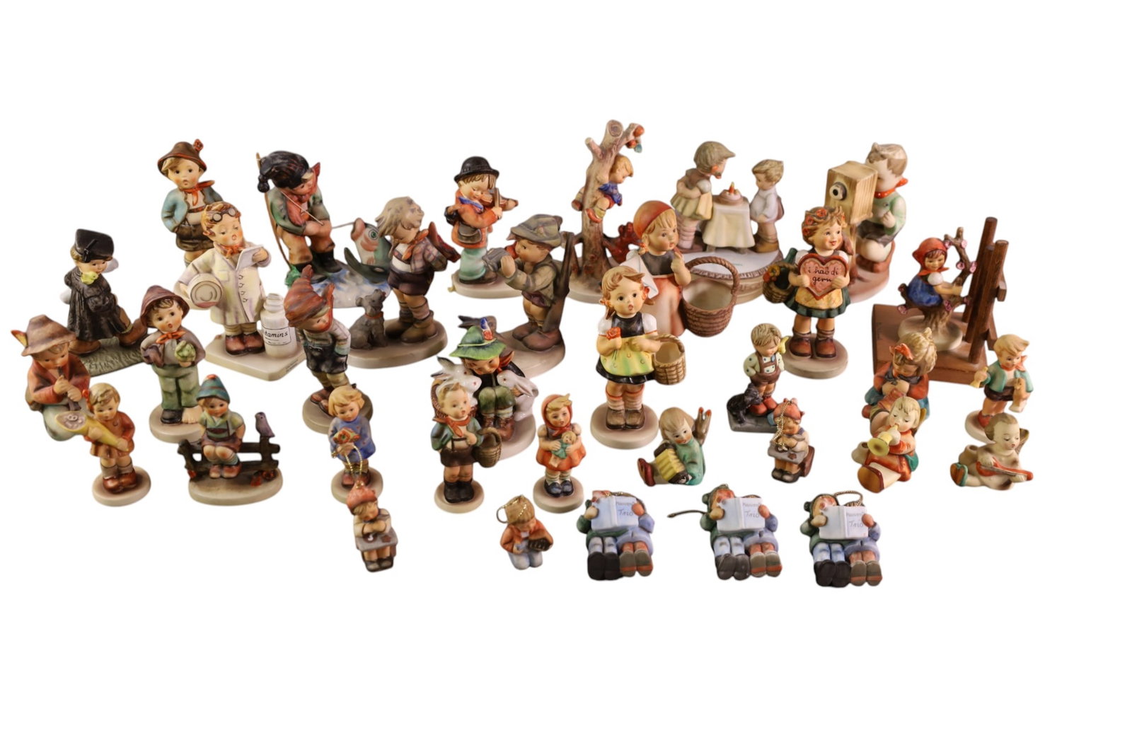 COLLECTION OF HUMMELS: LARGE COLLECTION OF HUMMELS, ORNAMENTS, FIGURES, AND MORE.