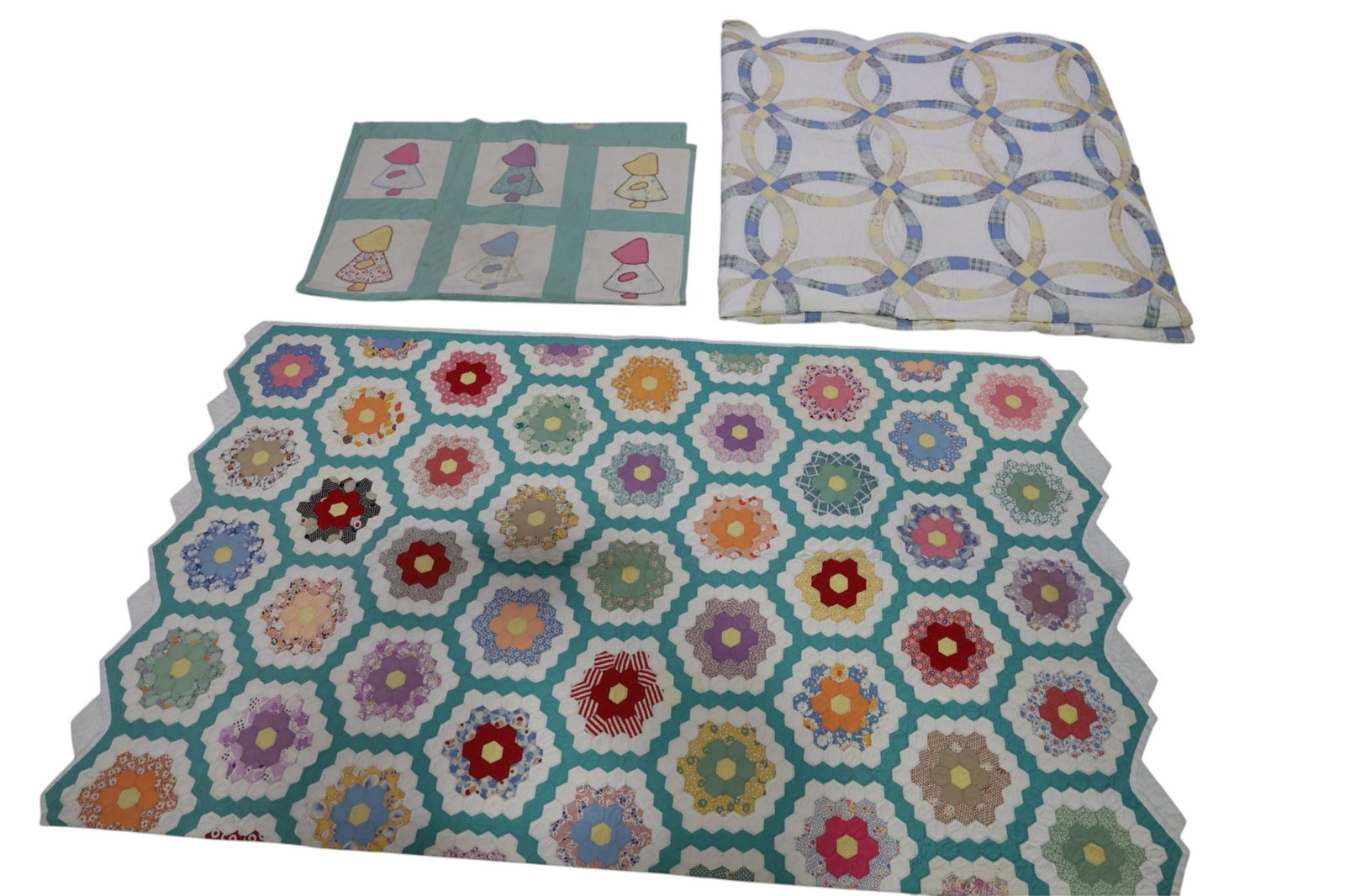 3 QUILTS: DOUBLE WEDDING RING, GRANDMA'S FLOWER GARDEN & BABY QUILT. SOME STAINS, 47" x 35" & 80" x 82" & 82" x 70"