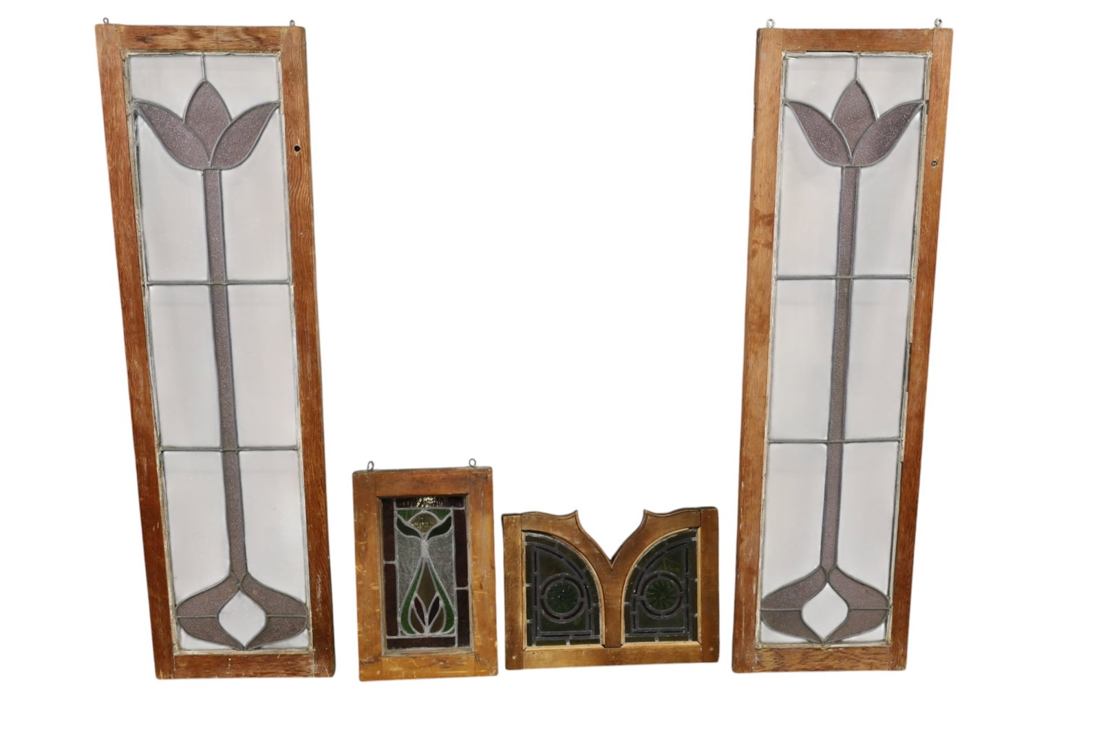 4 LEADED WINDOWS: 4 FRAMED LEADED WINDOWS, PAIR OF TALL ARTS & CRAFTS LEADED WINDOWS & 2 SMALL LEADED WINDOWS. 13 1/2" x 48" & 10 1/2" W & 16" W. THIS ITEM EXCEEDS SIZE LIMITATIONS FOR IN HOUSE SHIPPING, MUST BE