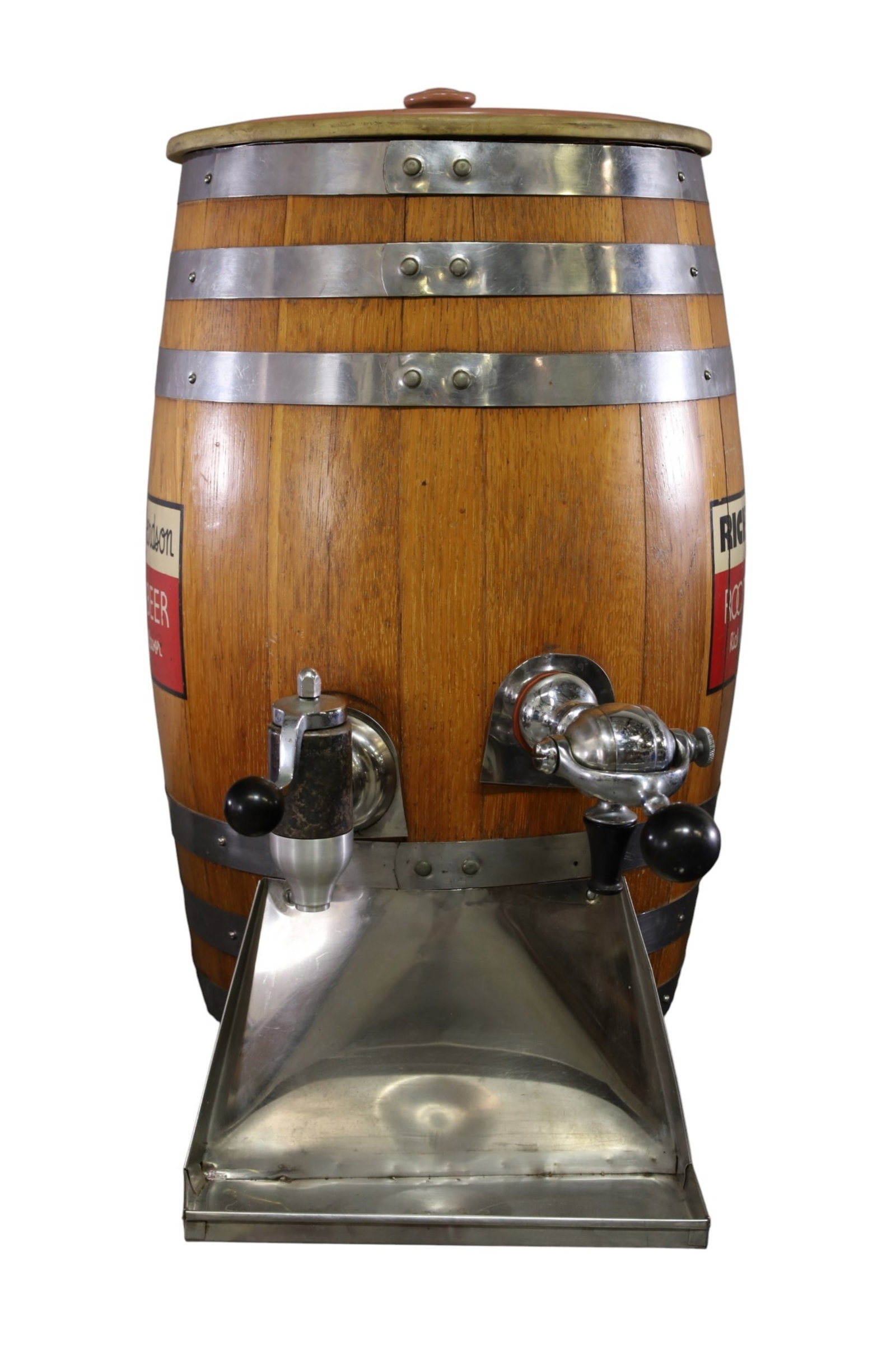 RICHARDSON ROOT BEER DISPENSER: DOUBLE DISPENSING ROOT BEER BARREL DISPENSER, SCRATCHES AND LOSS TO LABEL. 15" DIAM x 27" H. THIS ITEM EXCEEDS SIZE LIMITATIONS FOR IN HOUSE SHIPPING, MUST BE PICKED UP IN HOUSE OR SHIPPED VIA 3rd