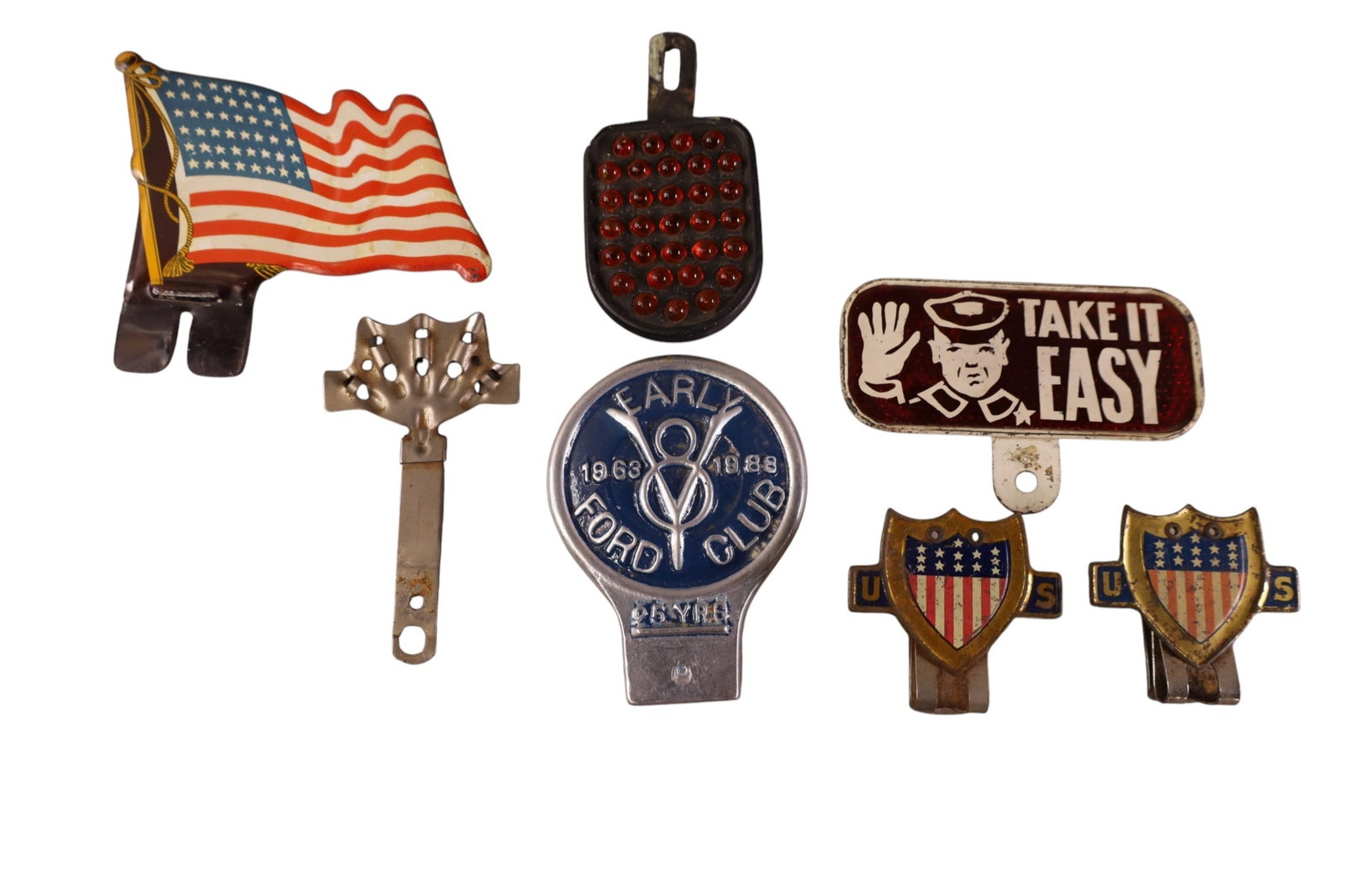 7 LICENSE PLATE TOPPERS: 7 MISC LICENSE PLATE TOPPERS, INCLUDING, EARLY FORD CLUB, TAKE IT EASY, AMERICAN FLAG, & MORE 3" - 5" H.