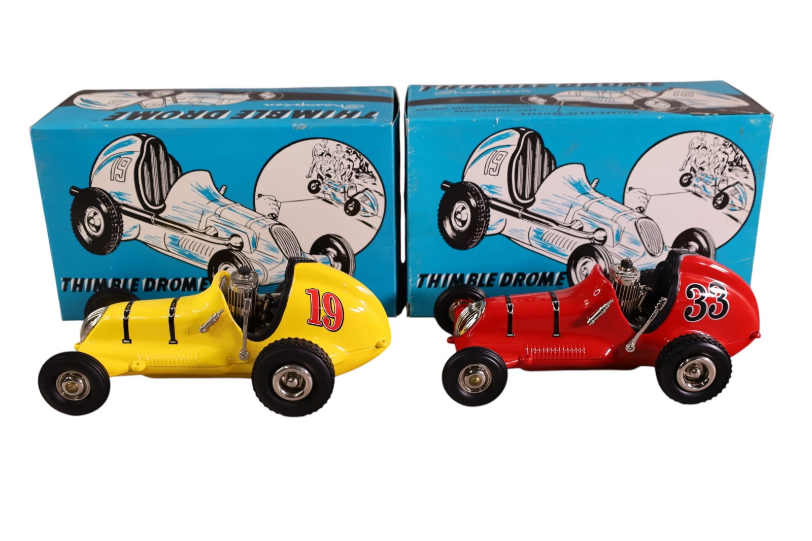 2 THIMBLE DRONE CARS: 2 THIMBLE DRONE, NYLINT PUSHERS. IN ORIGINAL BOXES. DATED 1998. 9 1/2" L