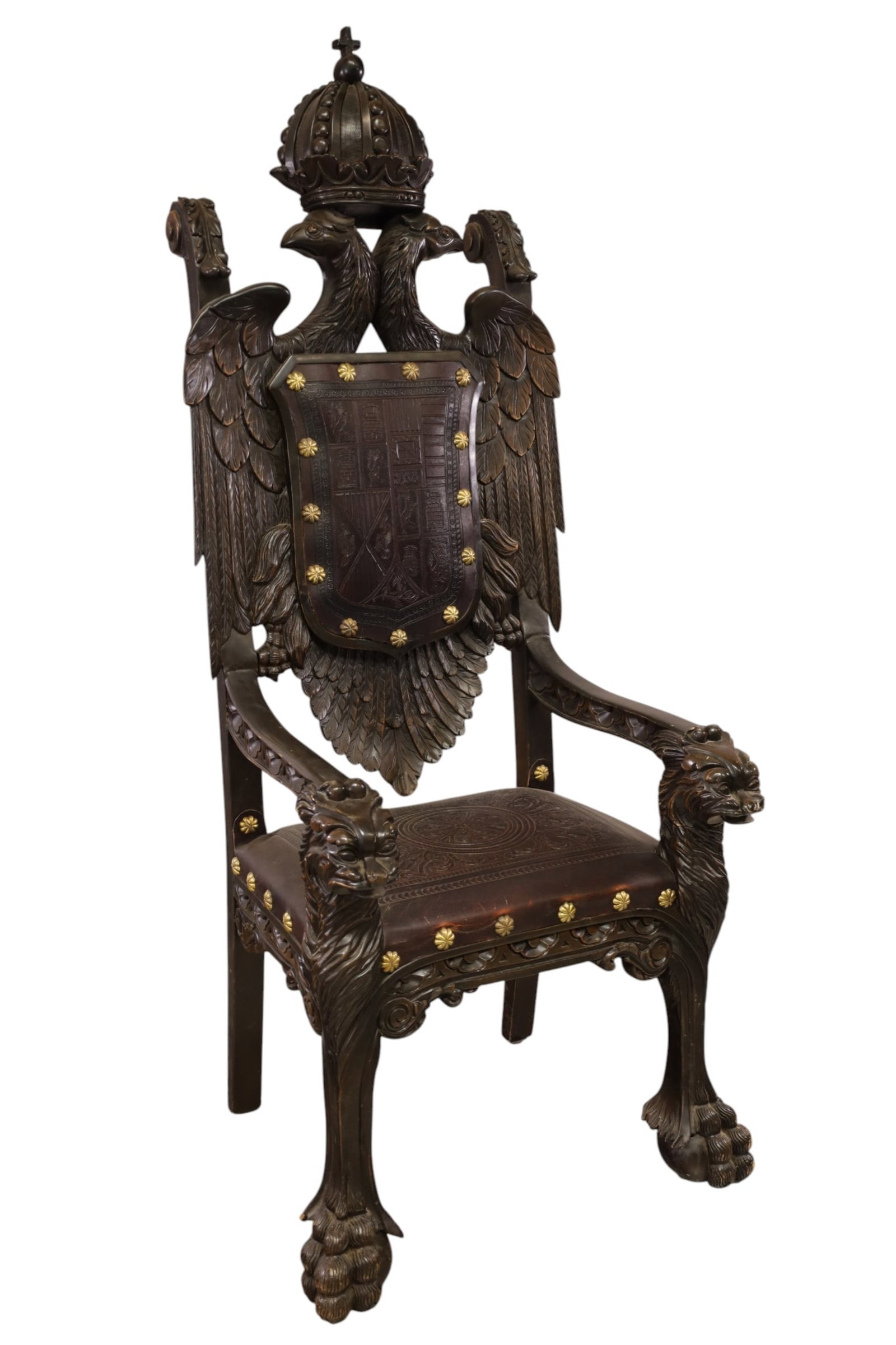 HIGHLY CARVED THRONE CHAIR: LARGE ANTIQUE HIGHLY CARVED THRONE CHAIR, LARGE BALL AND CLAW FOOT, LION HANDLES, ROMAN EMPIRE COAT OF ARMS TOP. 29" W x 19" D x 72" H THIS ITEM EXCEEDS SIZE LIMITATIONS FOR IN HOUSE SHIPPING, MUST