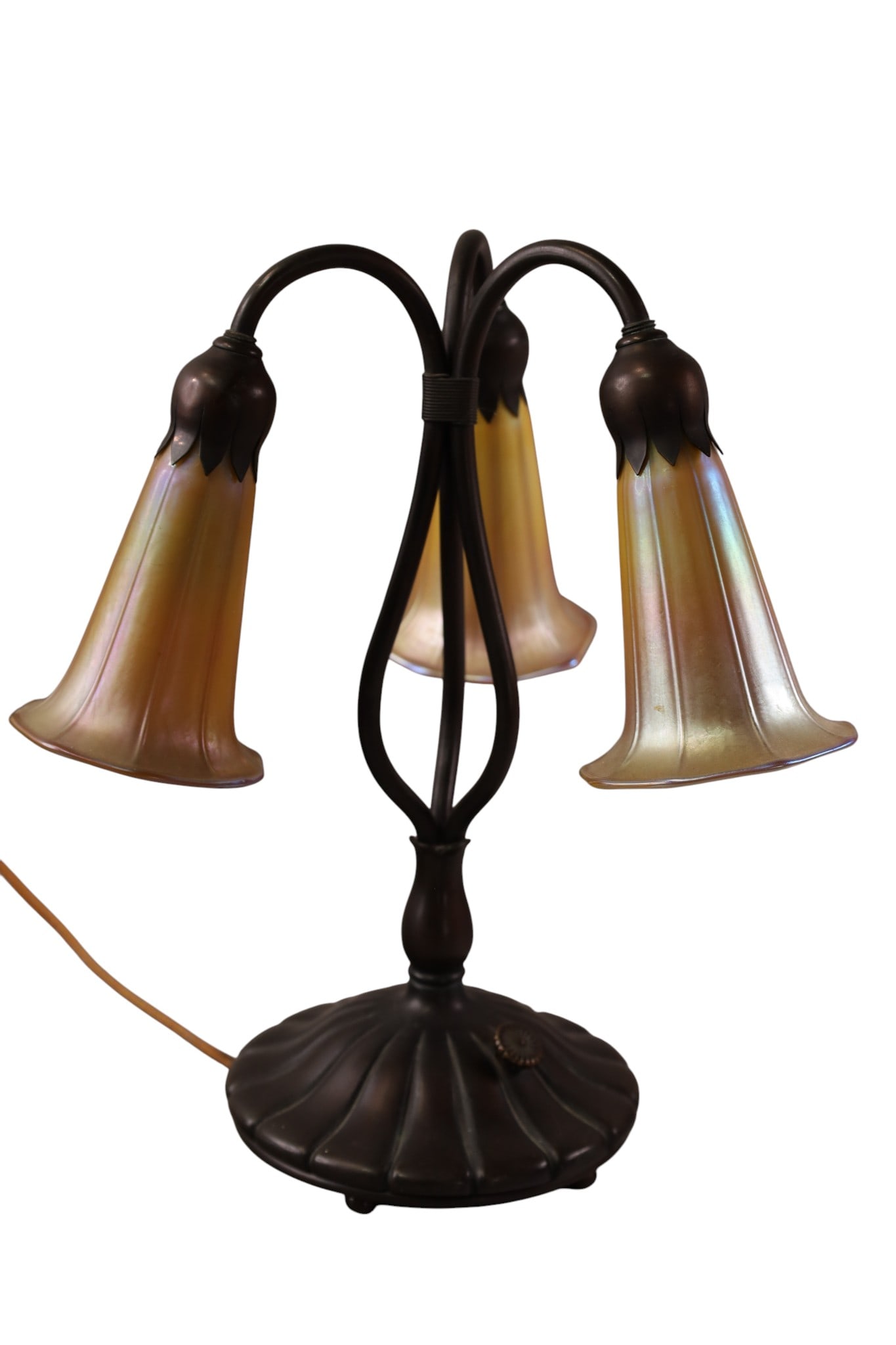 BRONZE TULIP LAMP: BRONZE THREE ARM TULIP LAMP WITH ART GLASS SHADES, SIGNED ON BASE. 12" H.