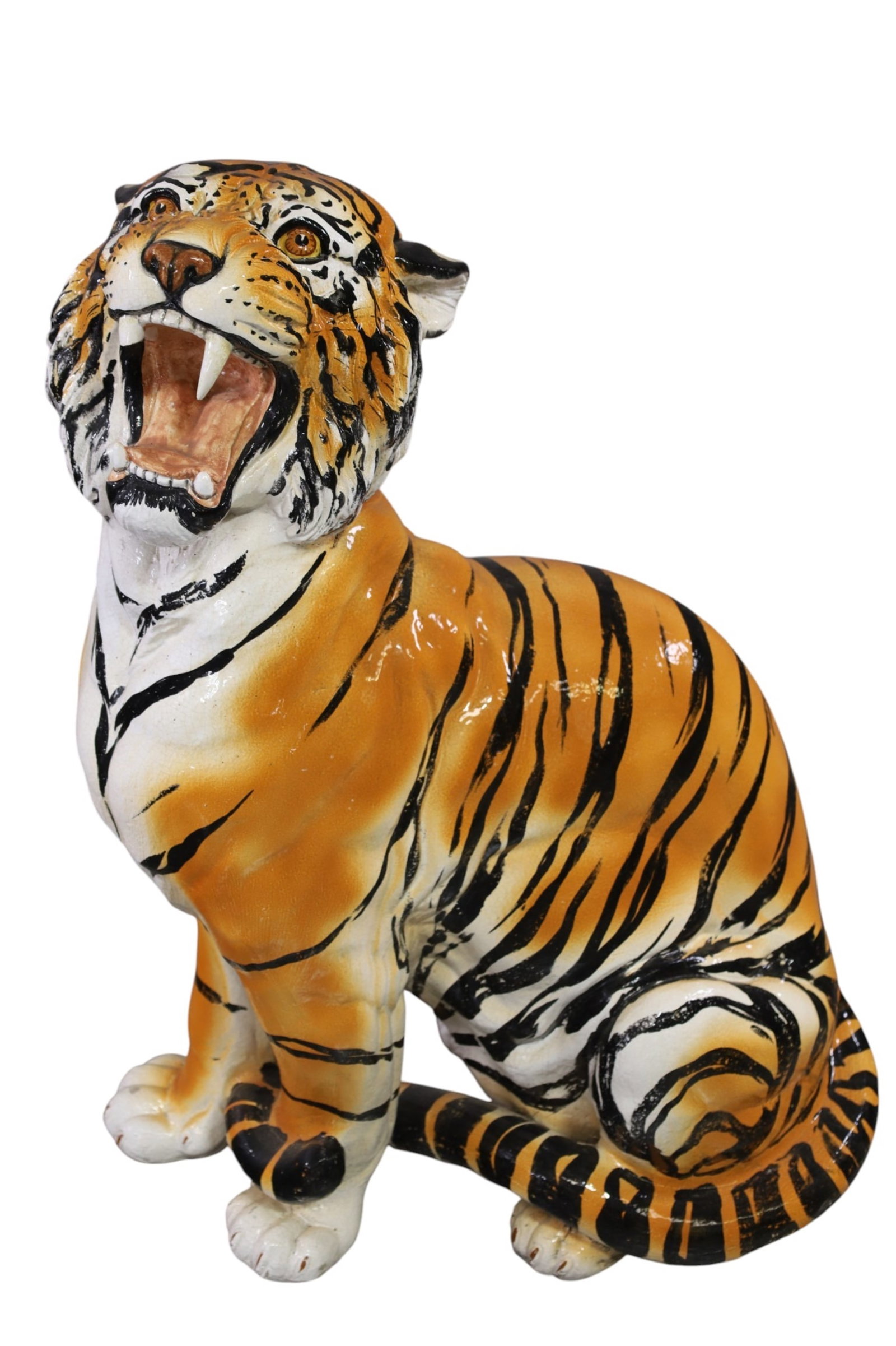 ITALIAN TIGER: ITALIAN HAND PAINTED PORCELAIN TIGER, ONE TOOTH IS BROKEN. 33" H. THIS ITEM EXCEEDS SIZE LIMITATIONS FOR IN HOUSE SHIPPING, MUST BE PICKED UP IN HOUSE OR SHIPPED VIA 3rd PARTY GROUND SHIPPER.