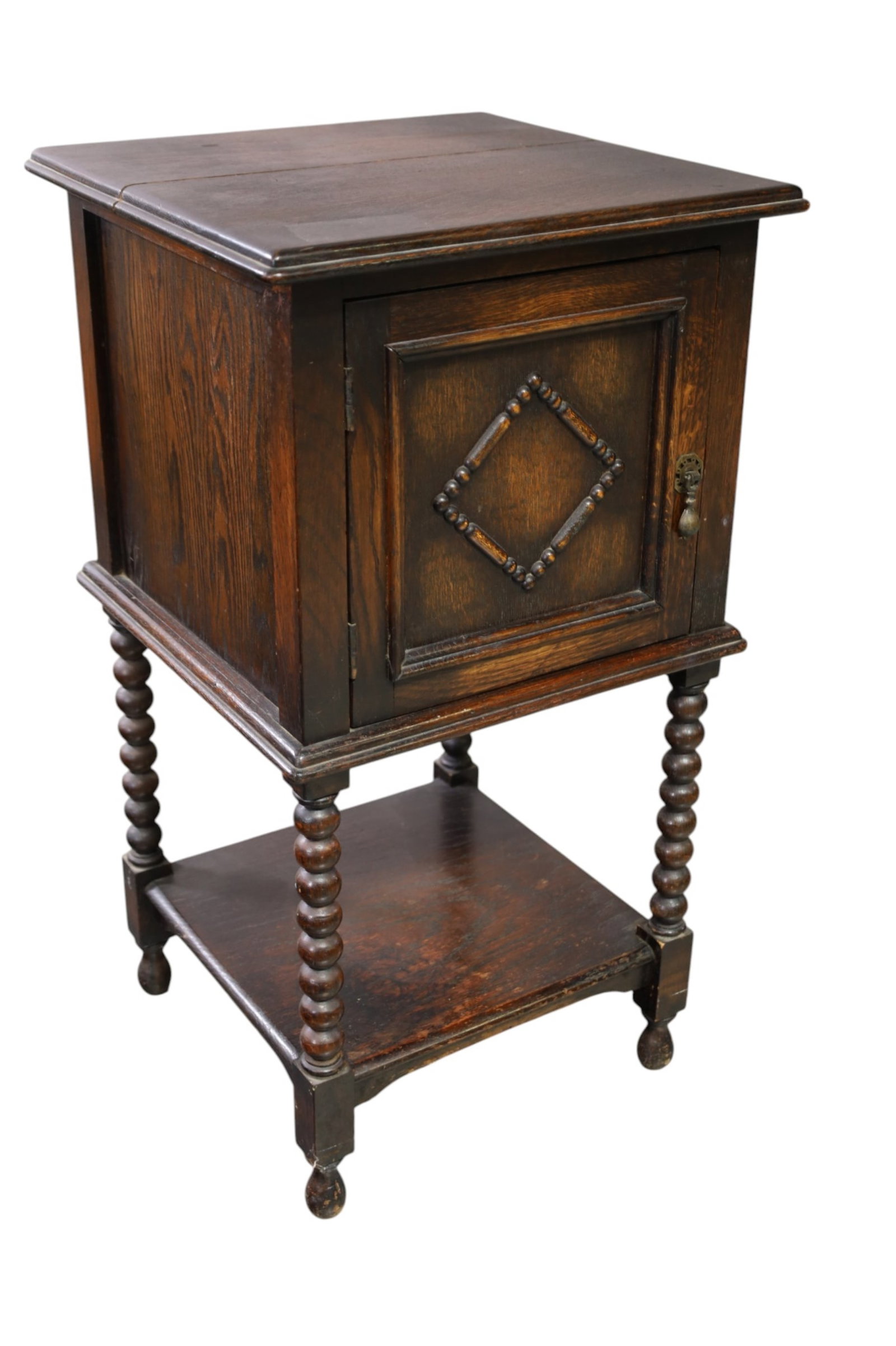 1910'S ENGLISH OAK NIGHTSTAND: SINGLE DOOR ENGLISH OAK NIGHTSTAND, SPLIT IN TOP. 16" W x 16" D x 29" H. THIS ITEM EXCEEDS SIZE LIMITATIONS FOR IN HOUSE SHIPPING, MUST BE PICKED UP IN HOUSE OR SHIPPED VIA 3rd PARTY GROUND SHIPPER.