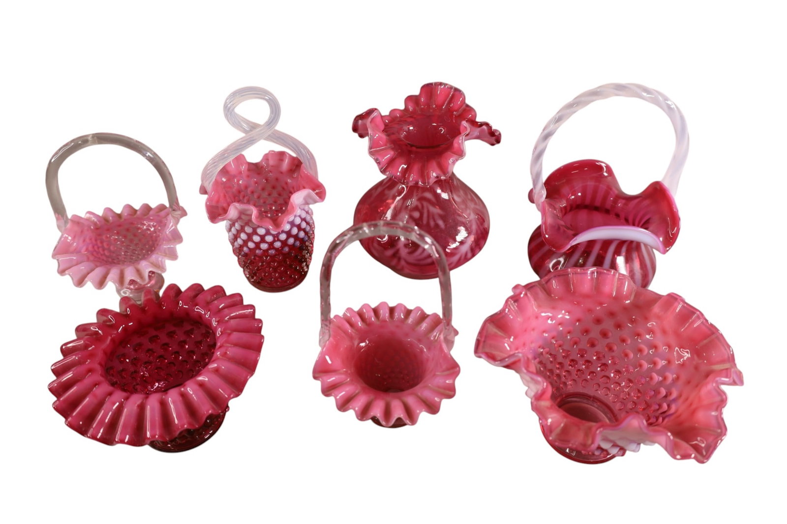 LOT OF CRANBERRY GLASS: FENTON BASKETS & VASES. HOBNAIL AND SWIRL. 5" - 7" H.
