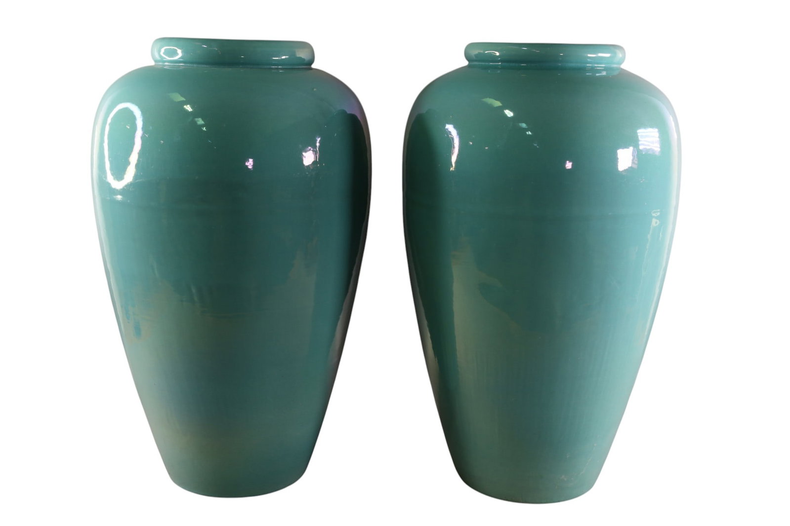 PAIR OF GLAZED OIL JARS: PAIR OF TALL GLAZED OIL JARS, CHIP TO INTERIOR GLAZE, UNMARKED. 23" H. THIS ITEM EXCEEDS SIZE LIMITATIONS FOR IN HOUSE SHIPPING, MUST BE PICKED UP IN HOUSE OR SHIPPED VIA 3rd PARTY GROUND SHIPPER.