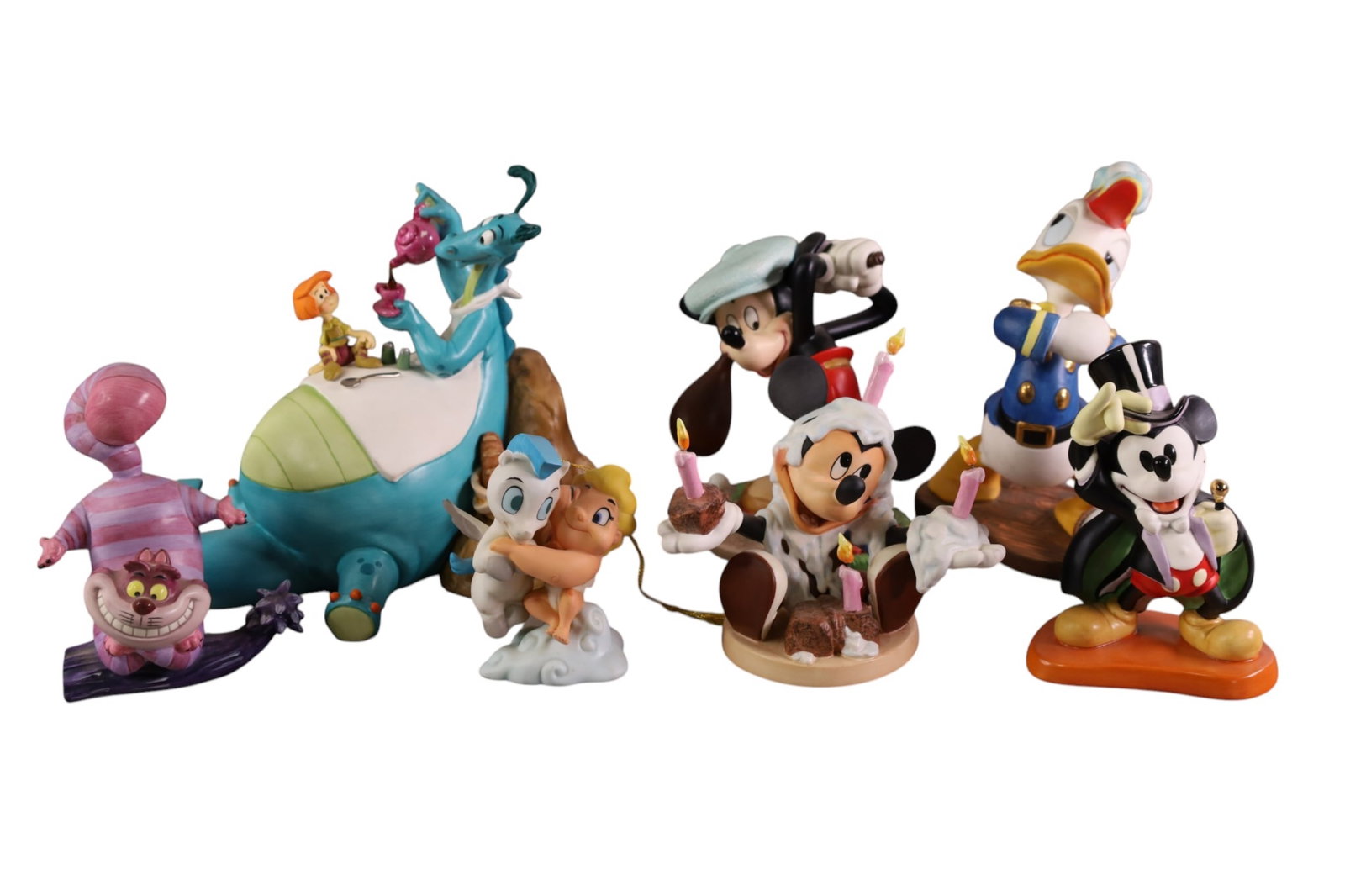7 WALT DISNEY FIGURES: MAGICIAN MICKEY, BIRTHDAY MICKEY, CANINE CADDY, DONALD DUCK, RELUCTANT DRAGON AND MORE. 3-1/2" TO 6"H. WITH BOXES