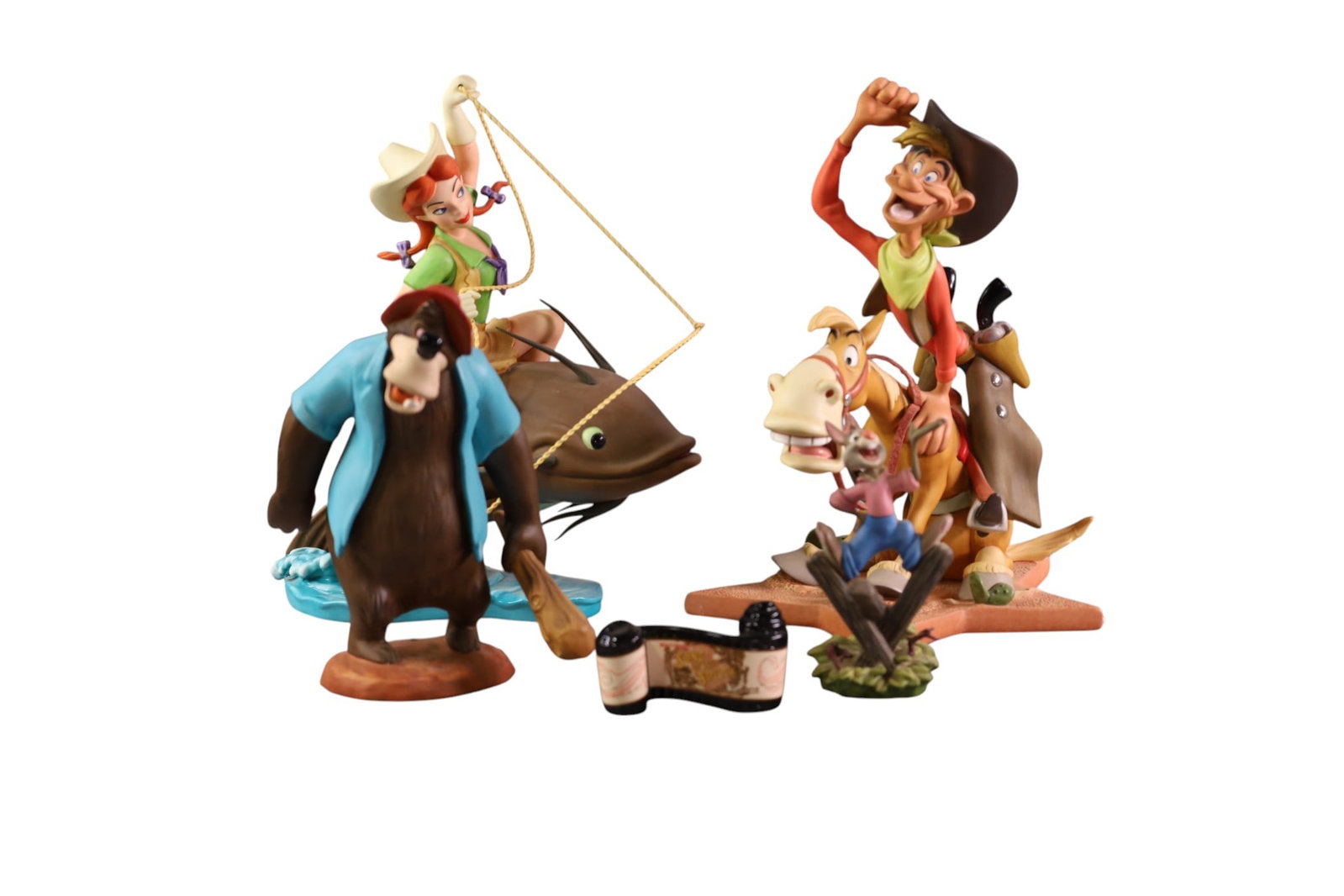 4 WALT DISNEY FIGURES: SONG OF THE SOUTH, BRER BEAR, BRER RABBIT, PECOS BILL, SLUE FOOT SUE. WALT DISNEY CLASSICS. 4-1/2 TO 10"H ALL WITH BOXES.