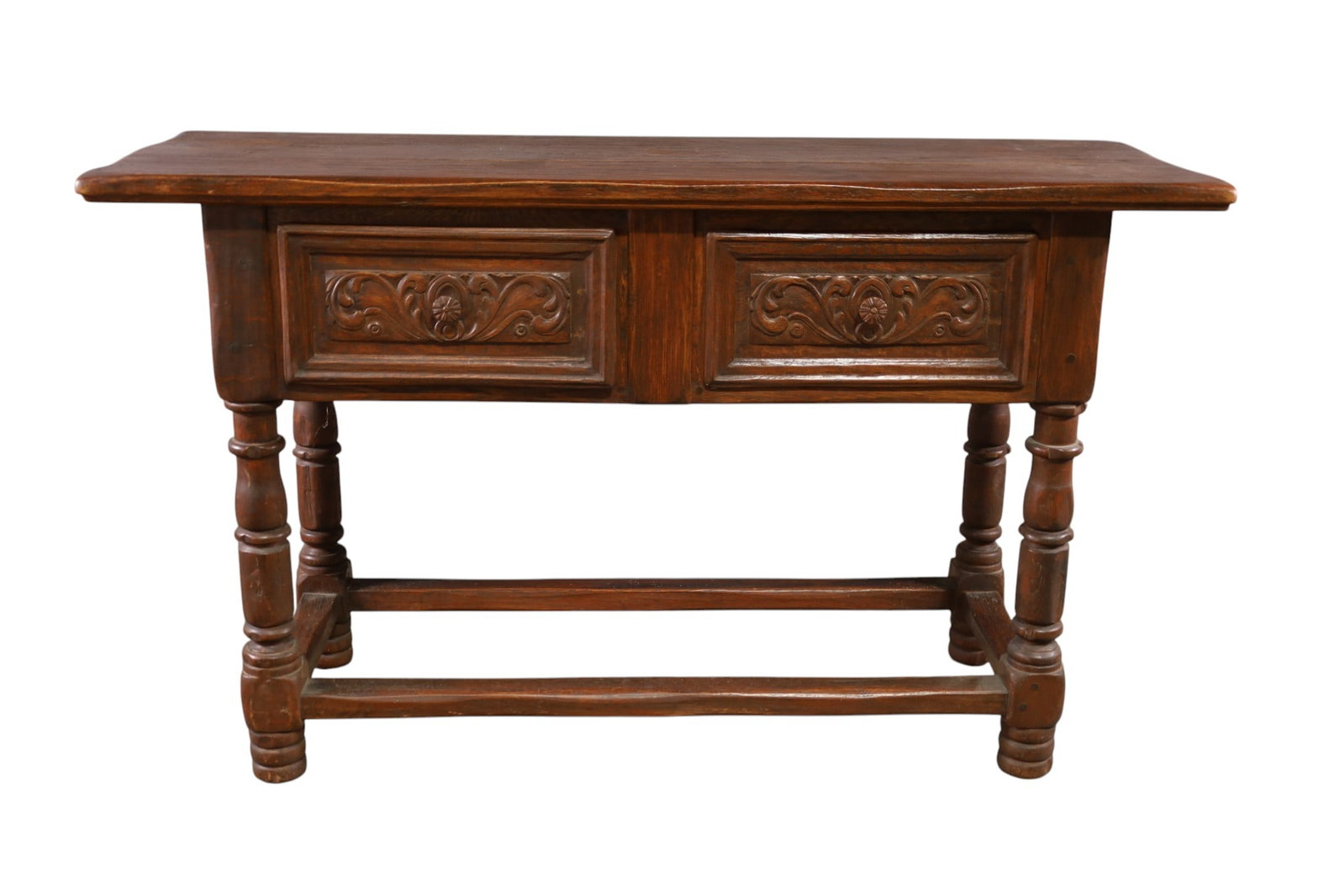 1930'S SPANISH SERVER: LARGE CARVED OAK, SPANISH SERVER, TWO DRAWER. MINOR WEAR TO FINISH. STAINS TO TOP. 60" W x 21" D x 36" H. THIS ITEM EXCEEDS SIZE LIMITATIONS FOR IN HOUSE SHIPPING, MUST BE PICKED UP IN HOUSE OR