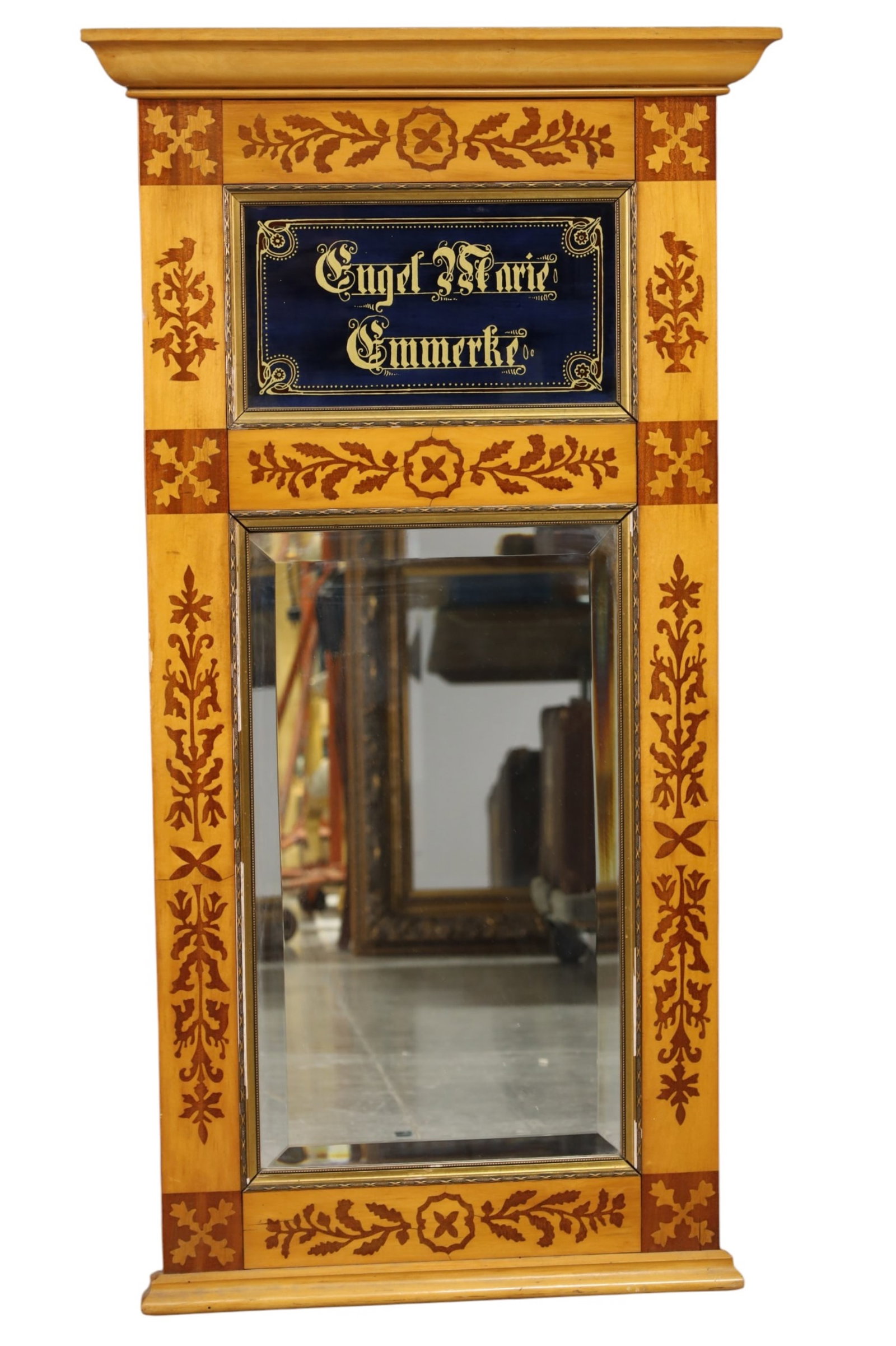 ANTIQUE INLAID WALL MIRROR: NARROW INLAID WALL MIRROR WITH UPPER SCRIPT, DAMAGE TO FRAME. 25 1/2" X 48 1/2" THIS ITEM EXCEEDS SIZE LIMITATIONS FOR IN HOUSE SHIPPING, MUST BE PICKED UP IN HOUSE OR SHIPPED VIA 3rd PARTY GROUND