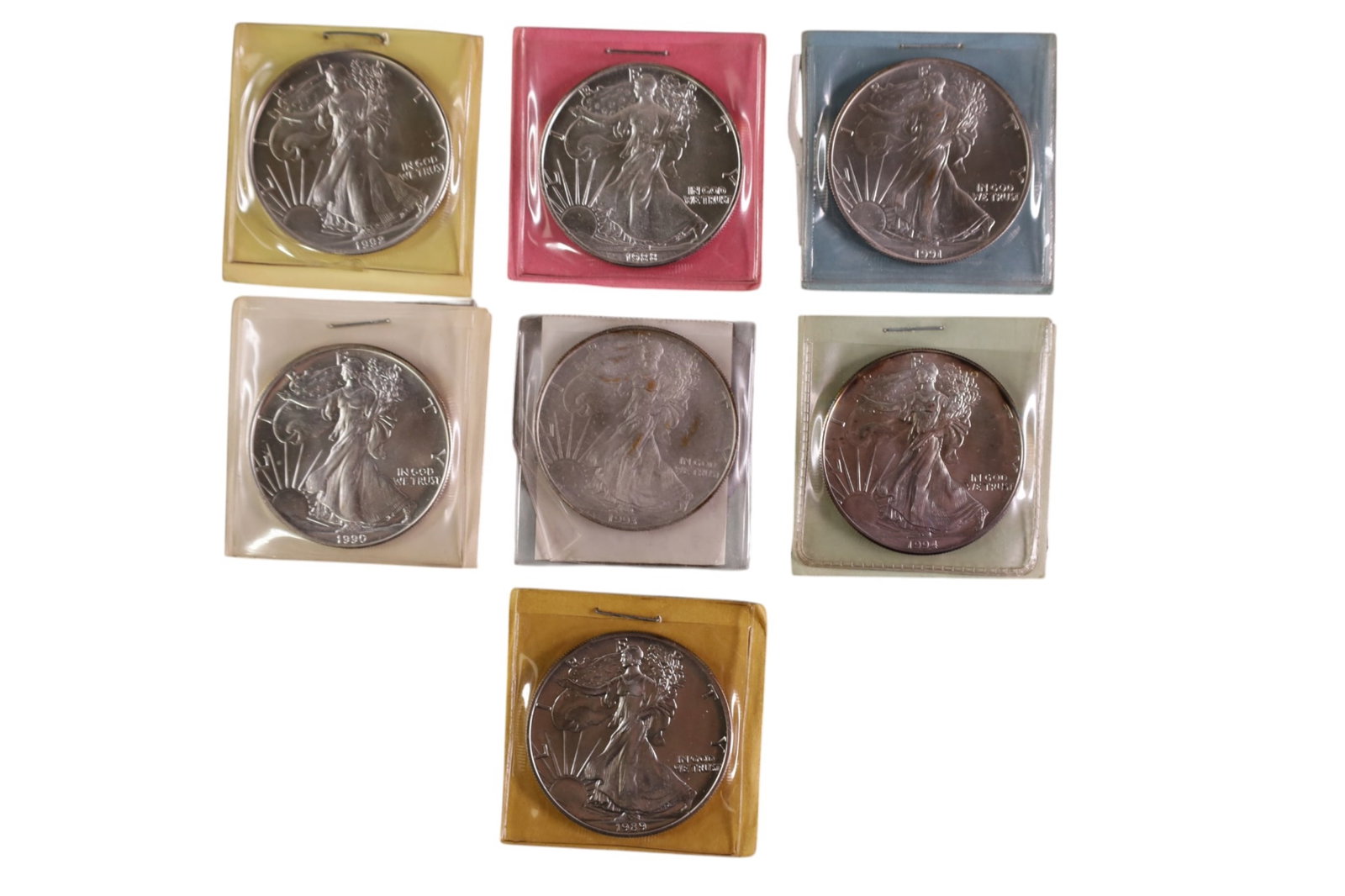 7 .999 SILVER DOLLARS: 7 WALKING LIBERTY SILVER EAGLE DOLALRS. 1 OUNCE .999 FINE SILVER.