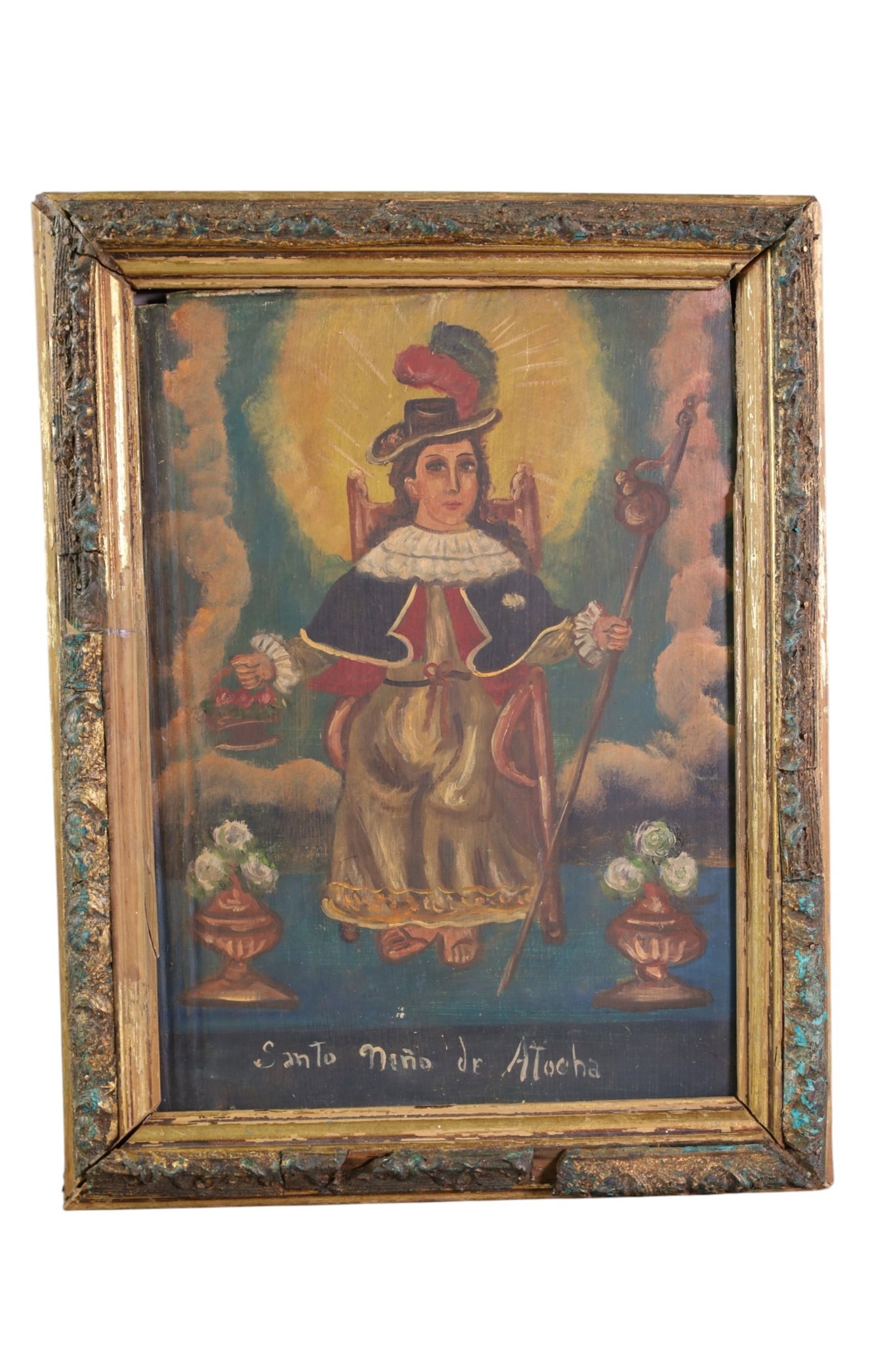 HAND PAINTED RETABLO: HAND PAINTED RETABLO ON TIN, SANTO NINO DE ATOCHA. IN GILT FRAME, SOME DAMAGE TO FRAME. 10 1/2" x 14" IN FRAME