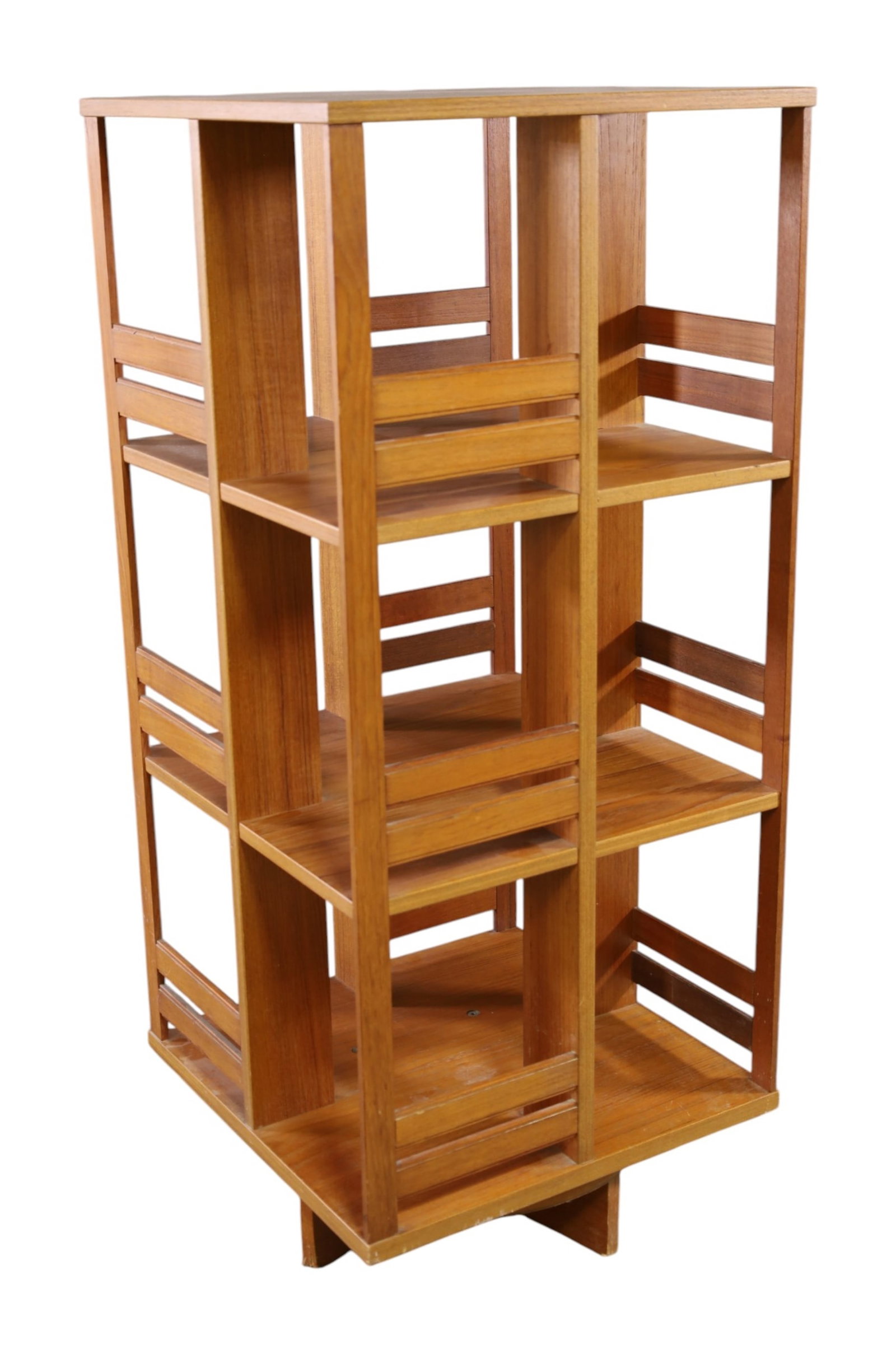 REVOLVING BOOKCASE: MID CENTURY MODERN REVOLVING BOOKCASE, WEAR TO FINISH. 19 3/4" W x 19 3/4" D x 45" H. THIS ITEM EXCEEDS SIZE LIMITATIONS FOR IN HOUSE SHIPPING, MUST BE PICKED UP IN HOUSE OR SHIPPED VIA 3rd PARTY