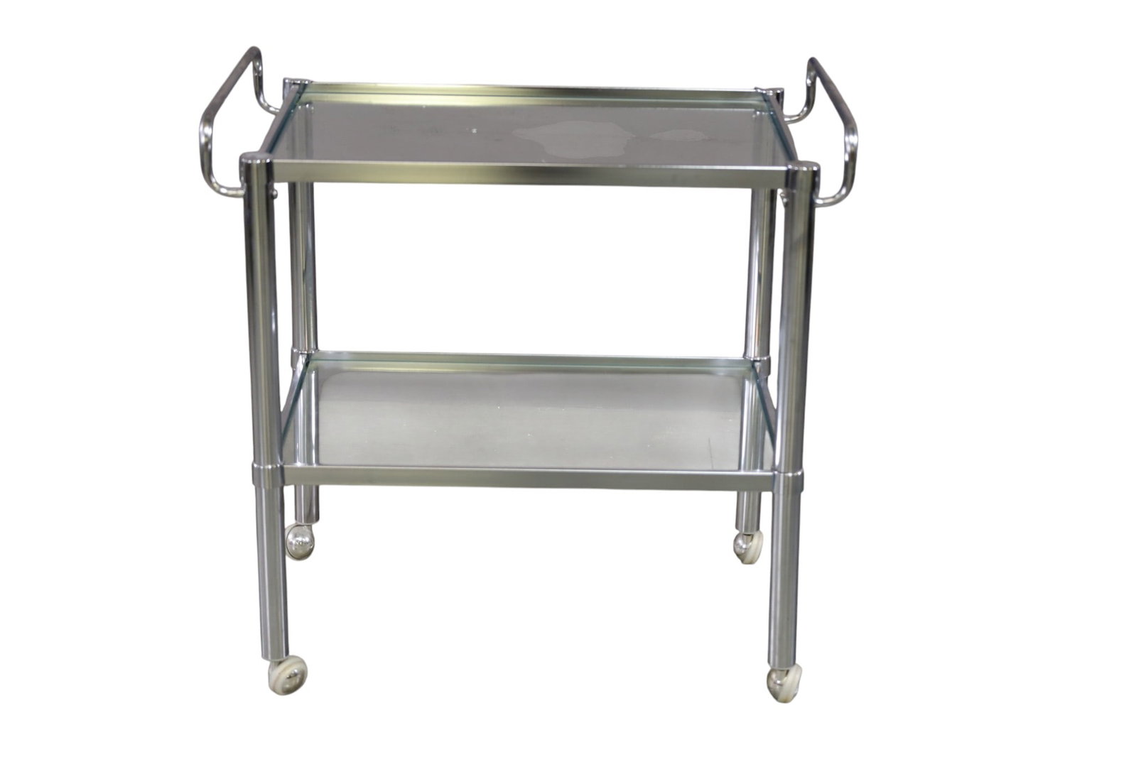 GLASS & CHROME BAR CART: VINTAGE TWO TIER GLASS AND CHROME BAR CART, 29" L x 18" W x 29" H. THIS ITEM EXCEEDS SIZE LIMITATIONS FOR IN HOUSE SHIPPING, MUST BE PICKED UP IN HOUSE OR SHIPPED VIA 3rd PARTY GROUND SHIPPER.