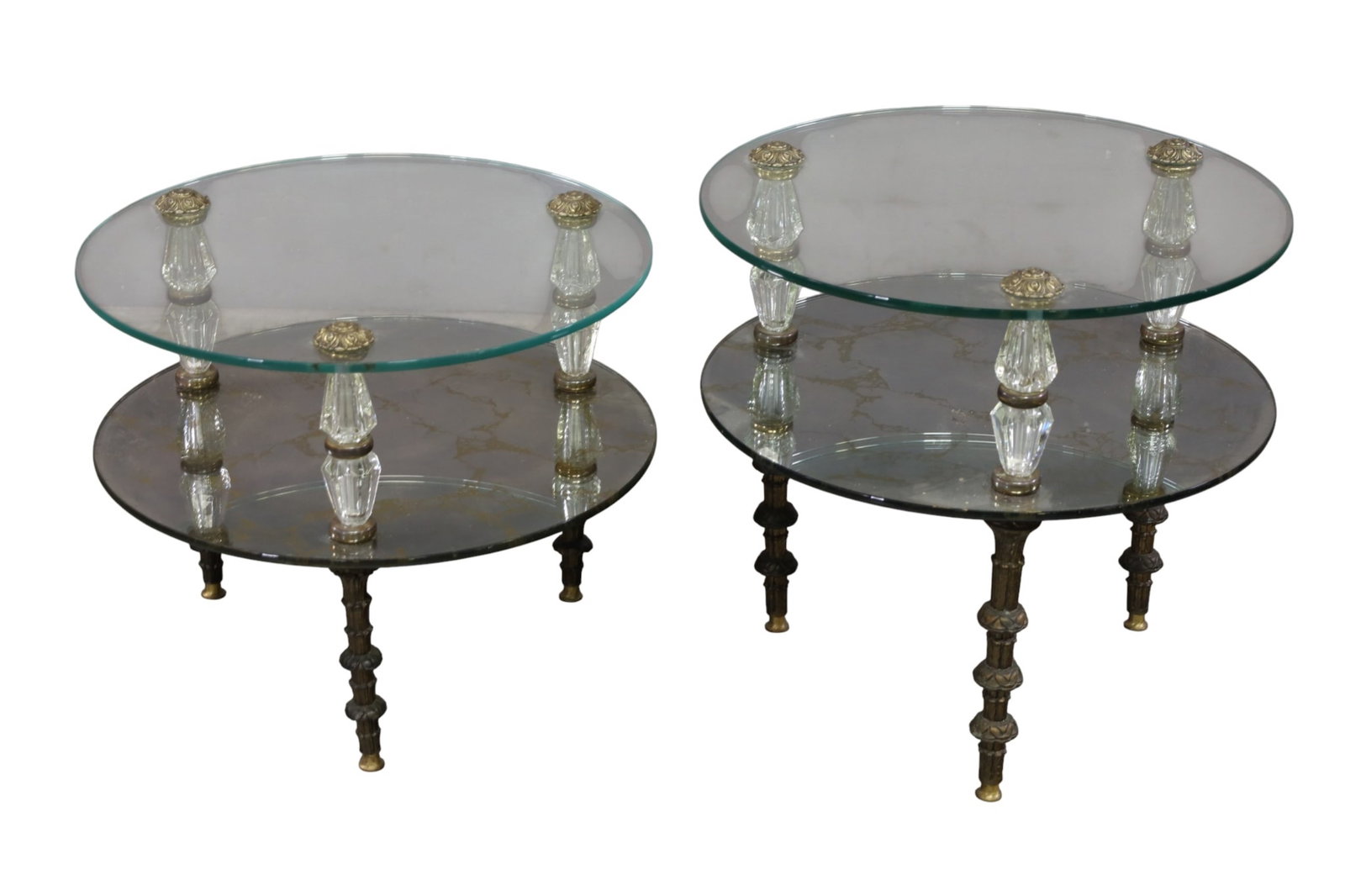 PAIR OF REGENCY SIDE TABLES: PAIR OF TWO TIER GLASS REGENCY SIDE TABLES, 22" DIAM x 18" H. - 20" H. THIS ITEM EXCEEDS SIZE LIMITATIONS FOR IN HOUSE SHIPPING, MUST BE PICKED UP IN HOUSE OR SHIPPED VIA 3rd PARTY GROUND SHIPPER.