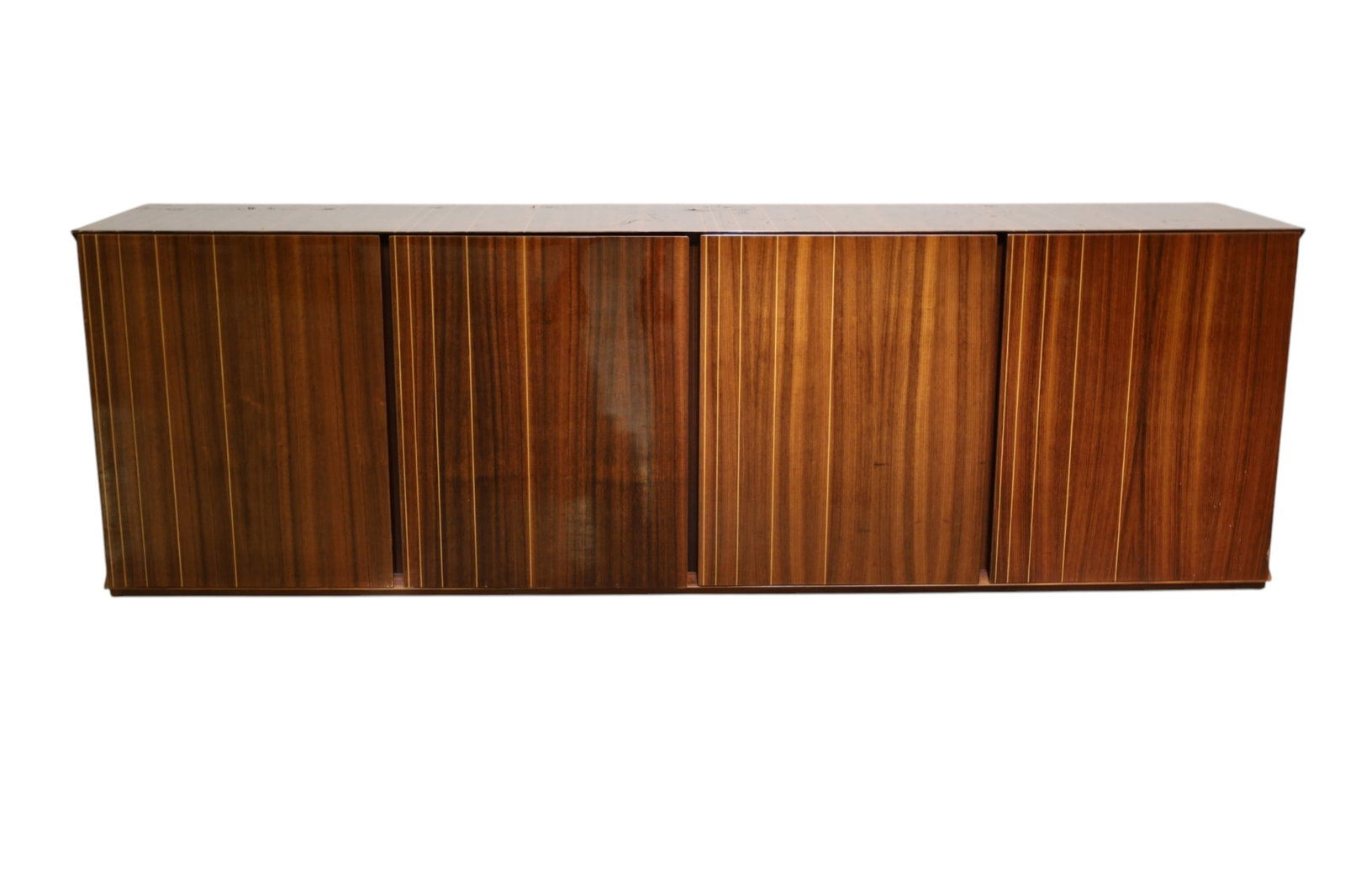 ART DECO STYLE CREDENZA: LARGE CONTEMPORARY HIGH GLOSS, INLAID FOUR DOOR ART DECO STYLE CREDENZA, SOME DAMAGE TO VENEER AND CHIPS TO CORNERS, DISCOLORATION TO FINISH. 90 1/2" W x 19" D x 29" H. THIS ITEM EXCEEDS SIZE