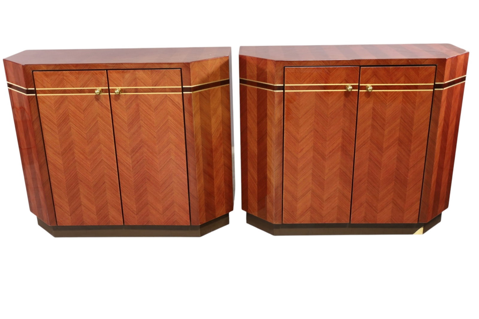 PAIR OF DECO STYLE CONSOLES: PAIR OF CONTEMPORARY TWO DOOR CONSOLES, HIGH GLOSS, INTERIOR SHELF. VENEER CHIPS. 39 1/2" W x 16" D x 33" H. THIS ITEM EXCEEDS SIZE LIMITATIONS FOR IN HOUSE SHIPPING, MUST BE PICKED UP IN HOUSE OR SHI