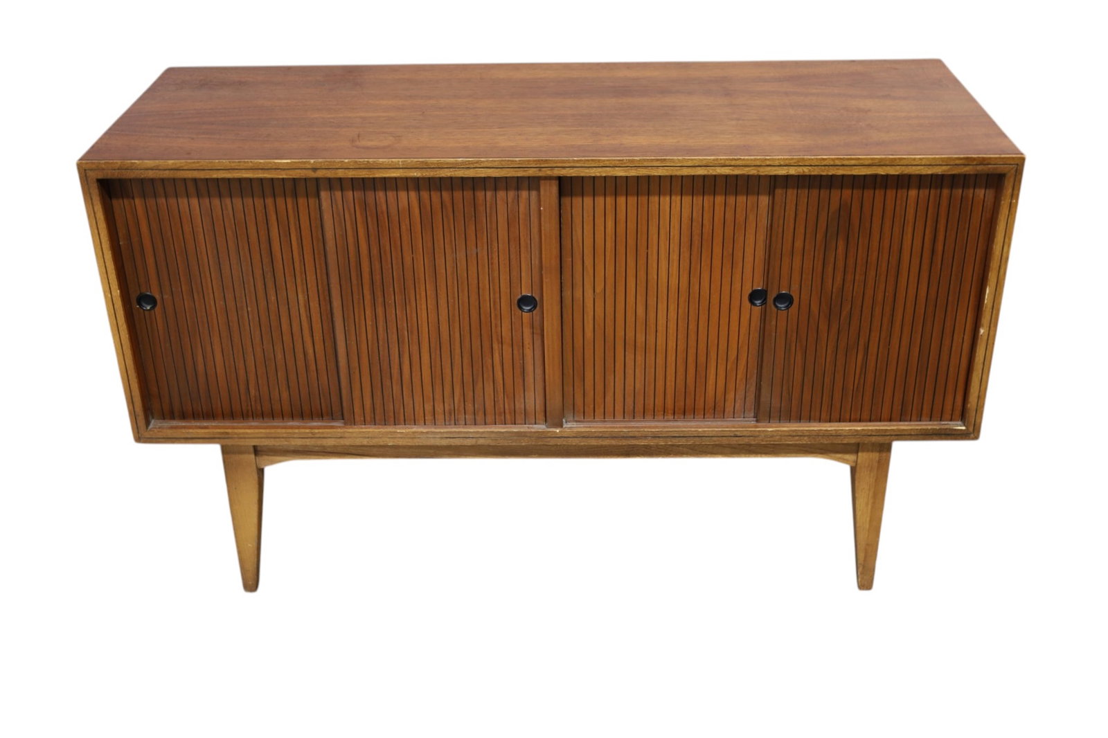 MID CENTURY MODERN RECORD CABINET: SMALL MID CENTURY MODERN RECORD CABINET, SLIDING DOORS, WEAR TO FINISH, SCRATCHES. STAINS. 42" W x 15" D x 25" H. THIS ITEM EXCEEDS SIZE LIMITATIONS FOR IN HOUSE SHIPPING, MUST BE PICKED UP IN HOUSE