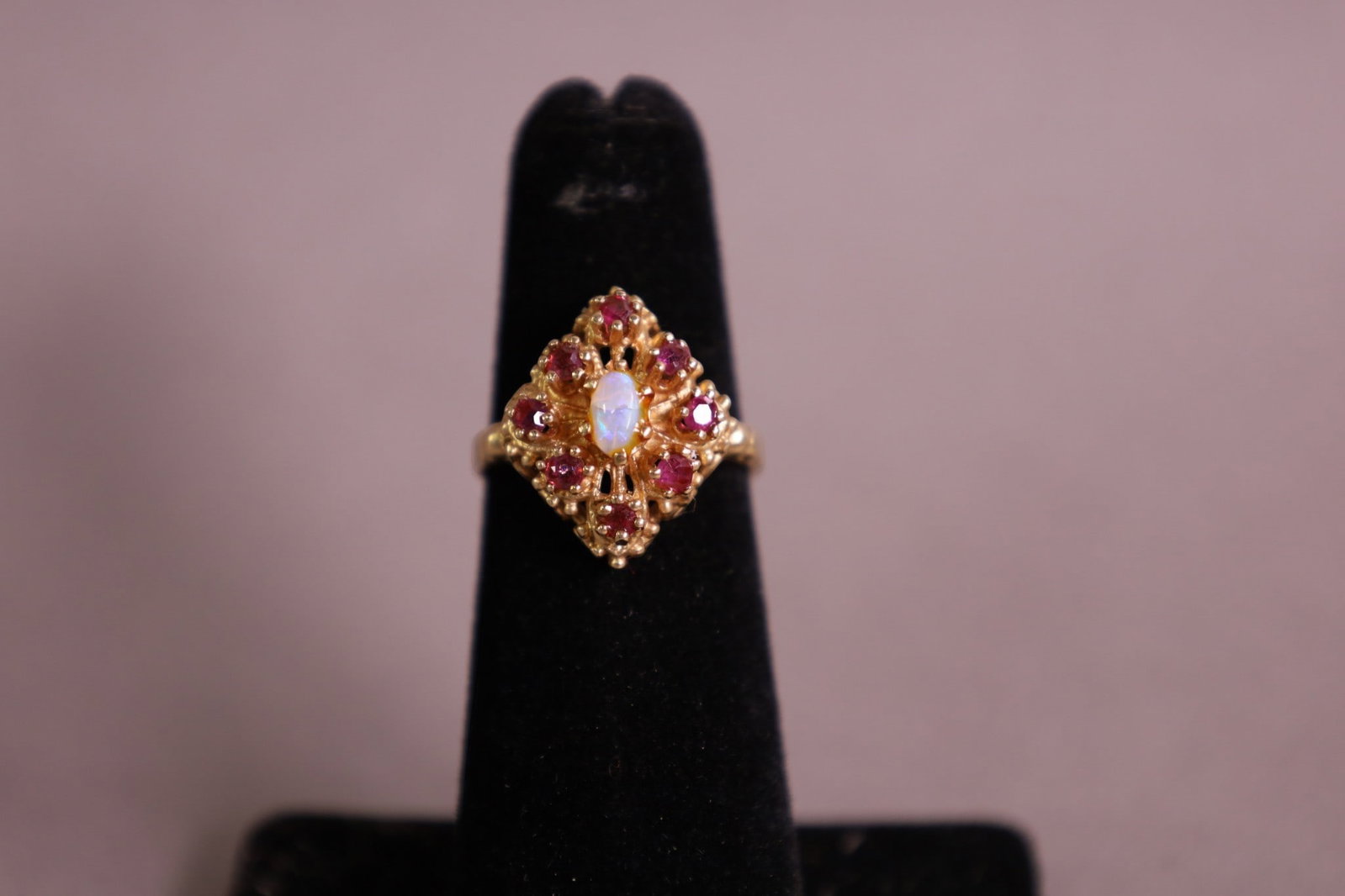 14K GOLD & RUBY RING: 14K GOLD, AND RUBY RING, WITH OPAL CENTER STONE. SIZE 5.5 APPROX 4 GRAMS