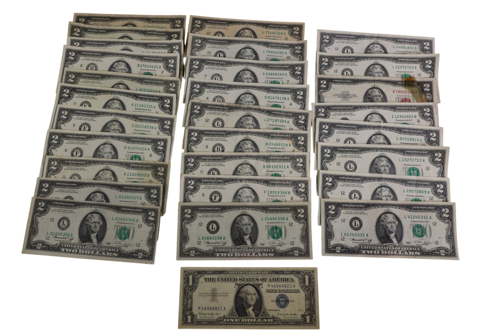 COLLECTION OF US CURRENCY: 29 TOTAL BILLS, 28 $2 BILLS, & 1957 SILVER CERTIFICATE $1 BILL.