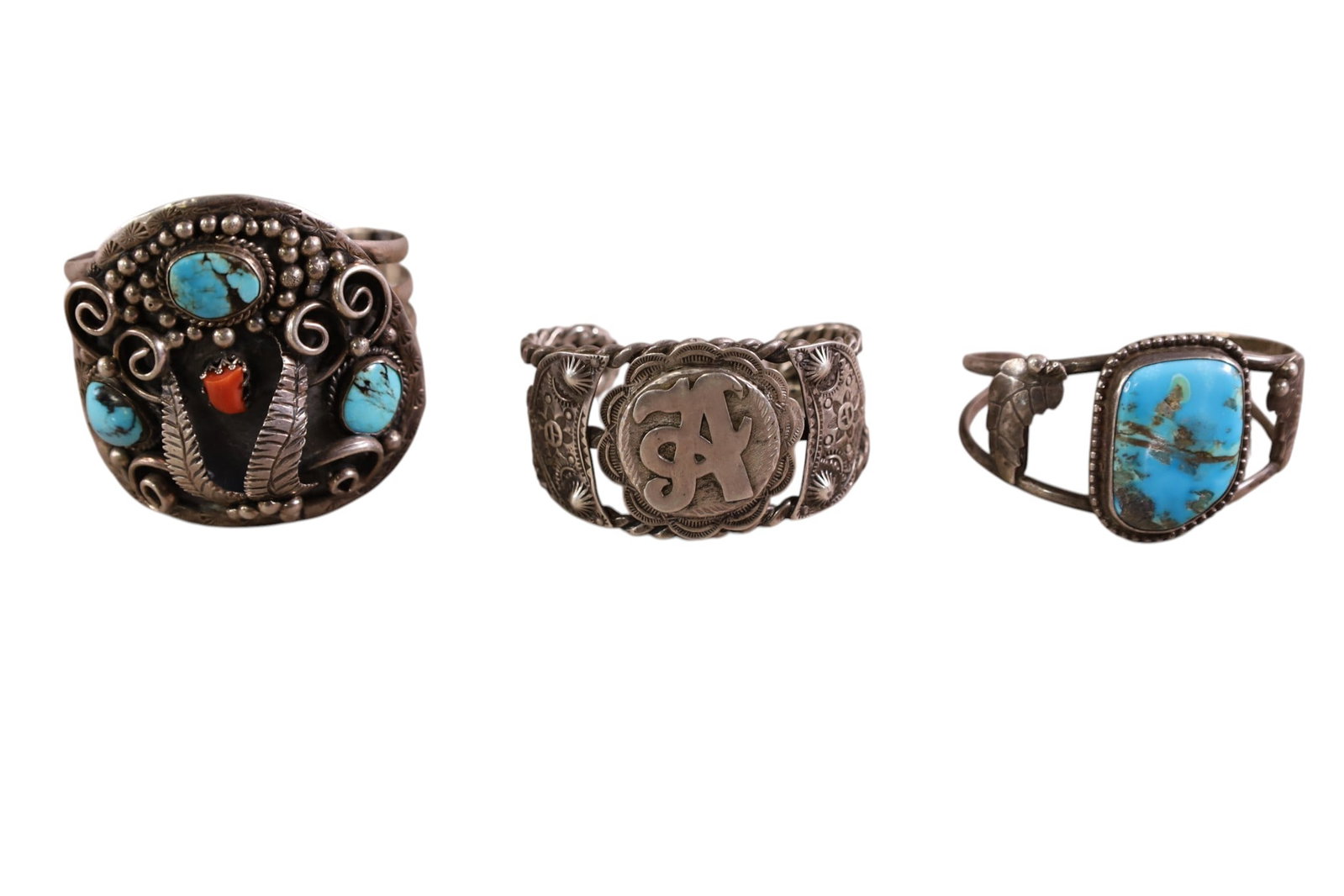 3 NATIVE AMERICAN CUFF BRACELETS: SILVER, TURQUOISE, CORAL NATIVE AMERICAN CUFF BRACELETS. SOME SIGNED.