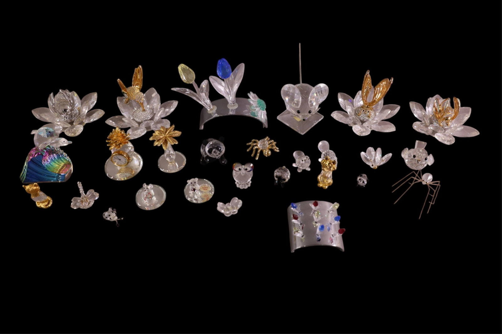 COLLECTION OF SWAROVSKI CRYSTAL: APPROX 20 PIECES, MOSTLY BIRDS AND FLOWERS.